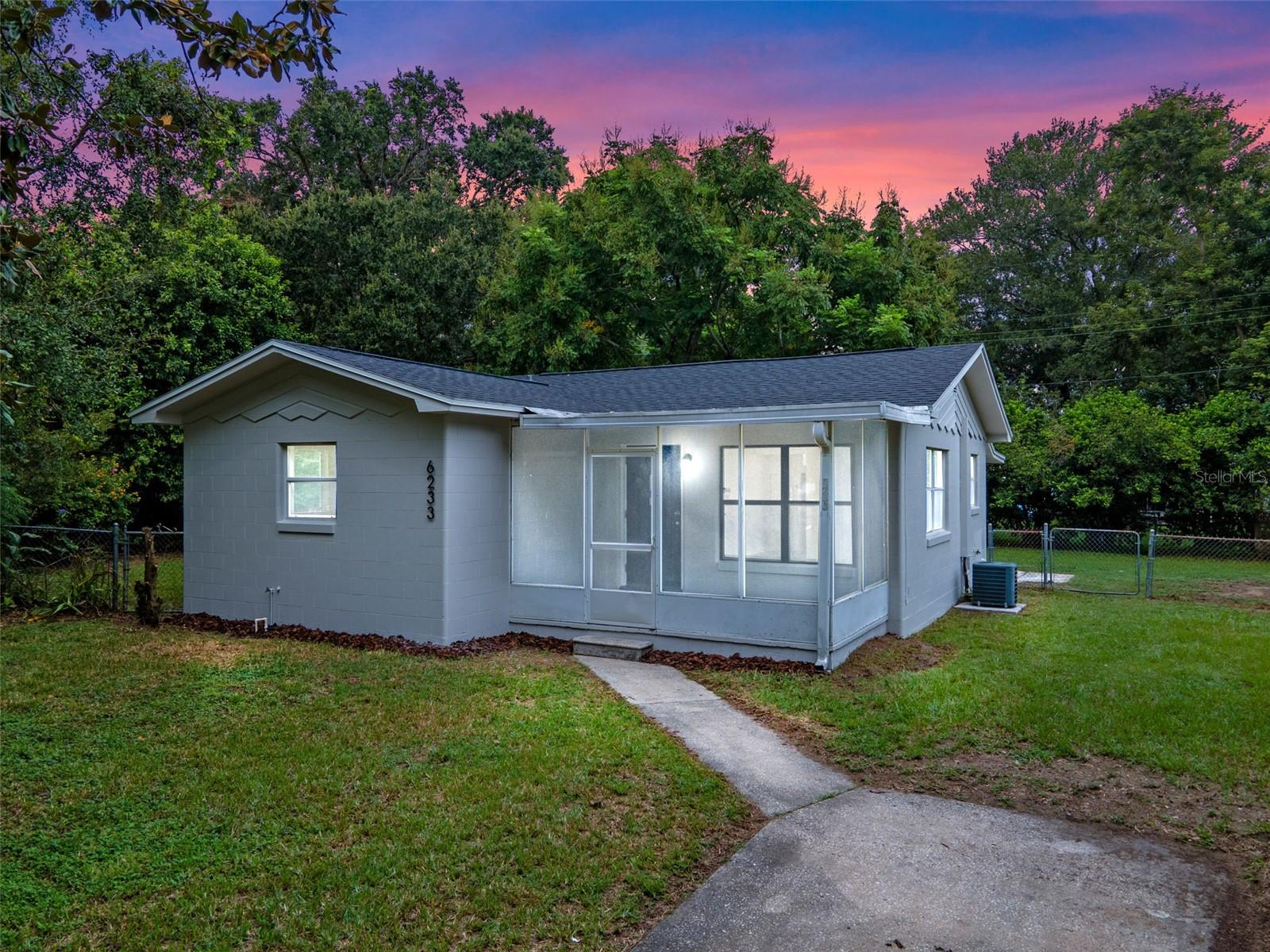 Welcome to 6233 Georgia Court, a move in ready home on a quiet cul-de-sac in Lakeland that has been beautifully refreshed inside and out. This charming property features a brand new permitted Architectural Shingle Roof completed in 2025, fresh interior and exterior paint, and New Luxury Vinyl Plank Flooring throughout. Step into the bright kitchen where you’ll find New White Shaker Cabinets, Laminate Countertops, updated appliances, and a modern sink and faucet. The bathroom has been stylishly updated with a New Vanity, toilet, faucet, and a freshly refinished tub and shower tile.
Every detail has been thoughtfully addressed with New Interior and Closet Doors, upgraded lighting, refreshed hardware, and updated electrical outlets and switches. A large unfinished storage room with laundry connections adds valuable space and convenience. The screened front porch offers curb appeal and functionality, while the large fully fenced backyard provides plenty of space for recreation or relaxation. The patio has also been freshly painted and the landscaping updated with mulch and cleanup, making outdoor living easy.
Important systems tested and functioning with a 2017 water heater, a Goodman HVAC condenser from 2014, and a Square D electrical panel, with plumbing inspected to ensure proper function. This home blends style, comfort, and reliability, offering modern updates while maintaining a cozy feel. With its extensive improvements and desirable cul-de-sac location, 6233 Georgia Court is the perfect choice for your next home.
