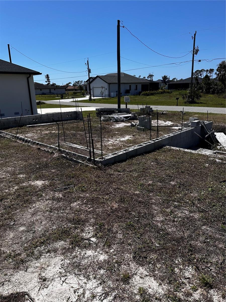 Ready-to-Build Lot with Golf Course Views in Rotonda West!
Why start from scratch when you can have a head start? This cleared and build-ready lot in the beautiful Rotonda West community comes with a poured foundation, approved building permits, and custom home plans included—saving you valuable time and money.
Enjoy panoramic golf course views right from your backyard, with a west-facing orientation that’s ideal for sunset views and perfect for designing a backyard oasis with a pool or outdoor lounge area. Public water and sewer connections are already available for added convenience.
Rotonda West is ideally located near Englewood and Boca Grande, offering easy access to gorgeous Gulf Coast beaches, marinas, boat ramps, world-class fishing, multiple golf courses, and a variety of dining and shopping options.
Whether you’re planning a full-time residence or a seasonal retreat, this unique property gives you a major head start on creating the Florida lifestyle you’ve been dreaming of. Don’t miss this rare opportunity to build quickly and easily in a sought-after location!