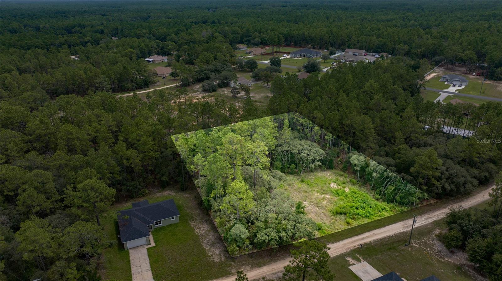 This spacious 1.15-acre lot in the desirable Rolling Hills subdivision is FULLY PREPARED FOR YOUR NEW HOME. The property has been PROFESSIONALLY CLEARED, SURVEYED, and includes a CONSTRUCTION PAD with DIRT ALREADY IN PLACE, saving you time and money in the building process.
Located just two lots from the paved road, and two blocks from 140th Avenue, this homesite offers both privacy and convenience. Duke Energy and Spectrum services are accessible, making it easy to connect utilities when you're ready.
Enjoy the peaceful setting of Rolling Hills with quick access to major roadways, shopping, dining, and Ocala's World Equestrian Center. Whether you're planning to build now or invest for the future, this is a fantastic opportunity.