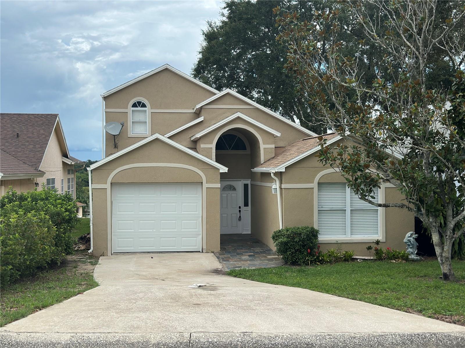 Beautifully renovated 3-bedroom, 3-bathroom single family home located in the highly sought-after Errol Estate community. This move-in ready property features soaring vaulted ceilings, a brand-new architectural shingle roof, and fresh interior and exterior paint. The upgraded kitchen boasts granite countertops and a full stainless steel appliance package. The spacious master suite is conveniently located on the first floor and includes a garden tub, separate shower, and dual sinks. Upstairs, you will find the third bedroom with its own full bath provides the perfect private retreat for guests. Enjoy outdoor living in the large screened patio overlooking the peaceful greenway. A rare opportunity to own a modernized home in a desirable neighborhood!
