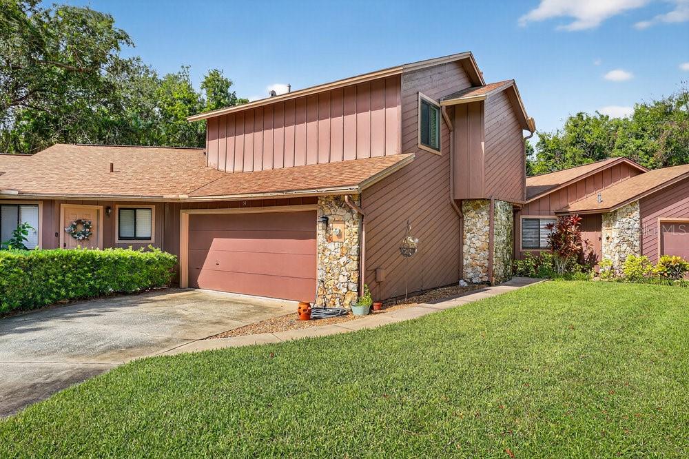 Step inside this beautifully renovated townhome in the heart of Ormond Beach’s sought-after Trails community. Every detail has been thoughtfully updated, creating a home that’s both stylish and move-in ready.
The main living area feels open and inviting with luxury vinyl plank flooring, fresh light fixtures, and a striking fireplace surrounded by sleek tile. The kitchen stands out with 42-inch wood cabinetry, granite countertops, a glass tile backsplash, and stainless steel appliances—no soffits here, just clean lines and plenty of storage.
All three bathrooms have been remodeled with designer finishes. The primary suite features a spa-like bathroom with a dual granite vanity, custom tile shower with glass enclosure, and access to a private balcony overlooking a peaceful wooded area. Guests will love the updated bath with its unique tub surround that combines function and style.
Additional updates include new interior and exterior doors, modern fans and A/C. Even the unseen improvements—subfloor, cement board, plumbing, switches, and outlets—have been taken care of.
The outdoor living space is equally inviting: French doors with built-in blinds open to a private patio and fenced yard with no rear neighbors. A large two-car garage and walk-in closets provide generous storage.
Living in The Trails means access to a pool, clubhouse, and miles of walking/biking paths. With shopping, dining, parks, and schools just minutes away, this home blends convenience with tranquility. Square footage received from tax rolls. All information recorded in the MLS intended to be accurate but cannot be guaranteed.