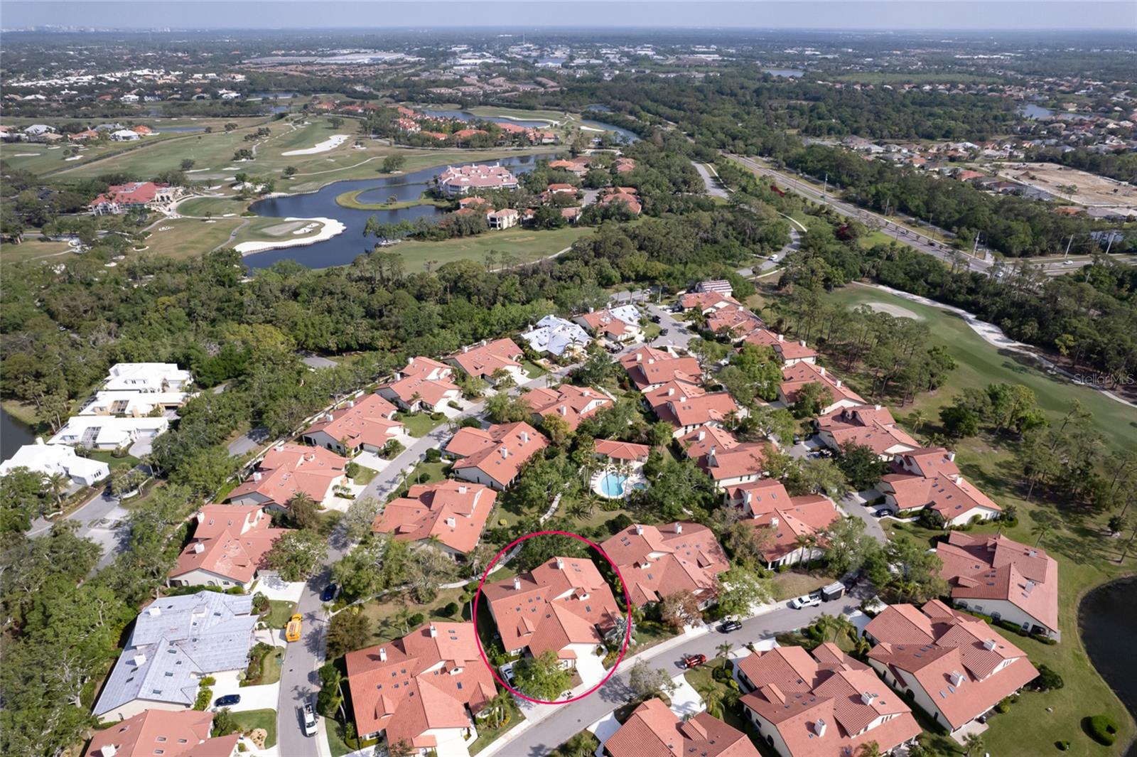 Welcome to this stunning 2-story, maintenance-free villa in Villa D’Este, located in the guard-gated, Audubon-sanctioned TPC Prestancia Golf Course community in Palmer Ranch. NEW ROOF SKYLIGHTS DOWNSPOUTS AND GUTTERS 2025. This 3BR, 3BA home features a spacious great room with soaring 25’ ceilings, skylights, large windows, a wood-burning fireplace, and built-in bookcase. The living area opens to indoor/outdoor patios with lush tropical landscaping. The kitchen includes stainless steel appliances, granite countertops, solid wood cabinetry, 2 pantries, a built-in desk, and a large breakfast nook with room for a table and sitting area. The main-floor primary suite offers 2 walk-in closets with custom built-ins and a spa-style bath with dual sinks, soaking tub, separate shower, makeup vanity, water closet, and linen closet. The first floor also features a formal dining room, guest bedroom, full bath, and a laundry room with sink and closet. Upstairs, a loft leads to a 3rd bedroom with walk-in closet, linen closet, and private bath—ideal for guests or multigenerational living. Additional highlights: 2-car garage with built-in storage, hurricane-rated sliders, and just steps to the community heated pool and spa. Minutes to Siesta Key & Nokomis Beaches, Legacy Trail, dining and shopping including Publix, Sprouts, Target, Lowes and Trader Joe's coming soon. Golf or social membership optional. Some photos virtually staged.