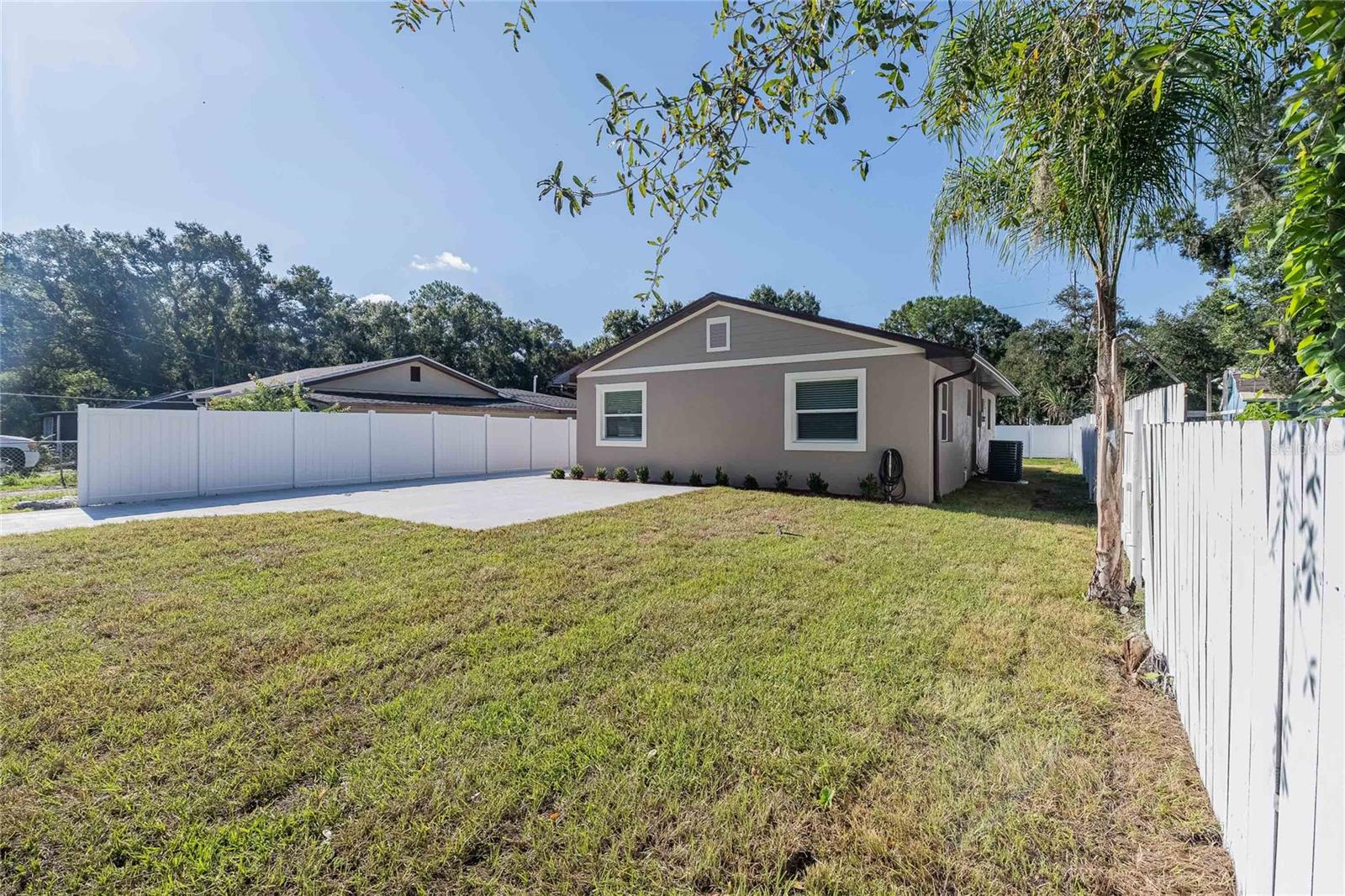 This beautifully renovated 3-bedroom, 1.5-bath home offers 1,200 sq. ft. of brand-new living space from top to bottom. No detail was overlooked, everything is brand new, including the roof, AC, driveway, fence, appliances, flooring, doors, sod and more. Step inside to an open and inviting floor plan with modern finishes throughout. The kitchen features sleek new appliances and an island for food prep, while the living areas are bright and airy, perfect for both relaxing and entertaining. Outside, you’ll enjoy a private, fully fenced yard with new grass sod and a fresh driveway for easy parking. Located in a convenient Lakeland neighborhood, this home is just minutes from shopping, dining, and within close proximity to McKeel Academy. All that’s left to do is move in and make it your own!