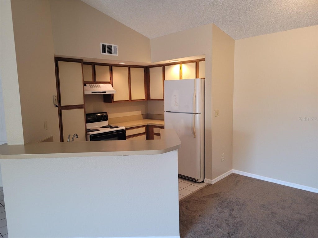 Photo of 5785 Gatlin Avenue #721, Orlando, FL 32822 (MLS # O6445926)