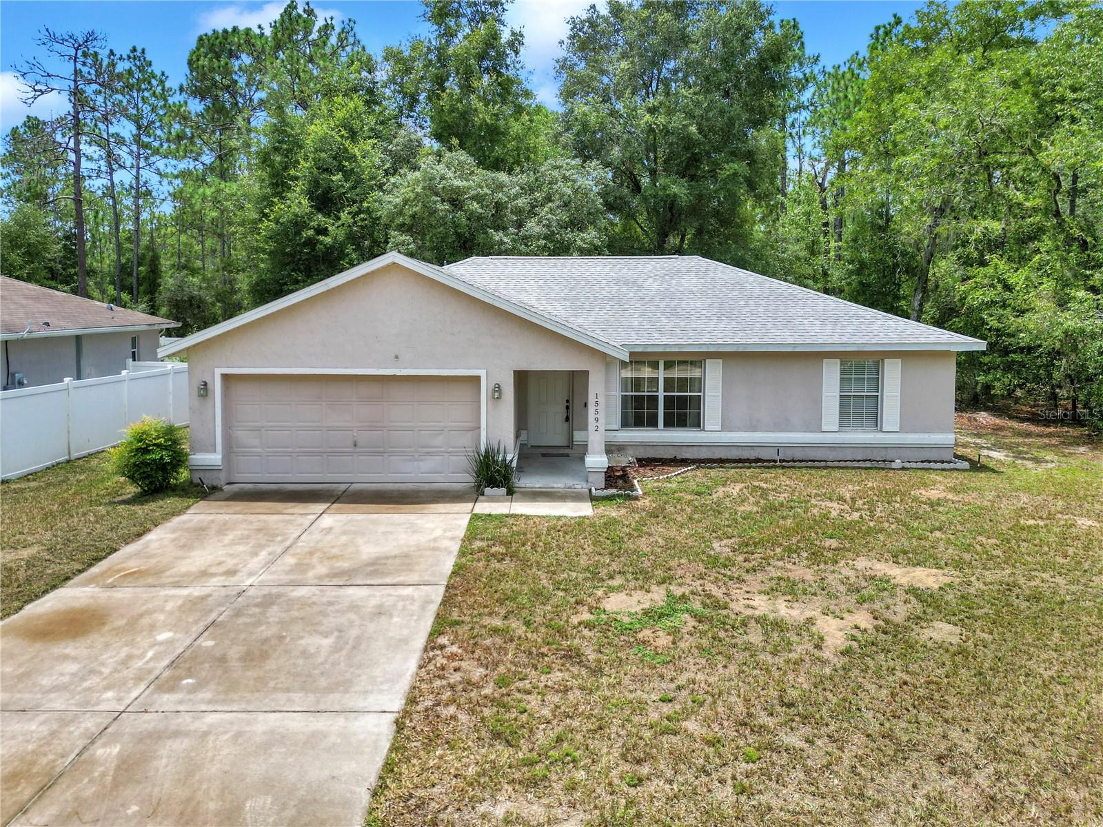 Home Sitting In Country Setting. This 1321 Sq Ft Home Under Air Plus 460 SQ FT Under Roof Will Impress You With Its Room Sizes & No Updates Needed. Walking Into The Home You'll Notice Is Well Maintained, Clean & Painted. Impressive Living Room Sizing 17ft x 13.5ft, Offering Multiple Choices For A Large Flat Screen TV & Furniture. The Dining Area Is Off The Updated Kitchen W/Pantry Both Spaces Open To The Back Porch W/Views of Trees & An Occasional Deer or Turkey. The Homes 3 Bedrooms & 2 Bathrooms Follow A Split Bedroom Floor Plan. The Primary Bedroom Measurements Are 14.5 x 13 Plus True Walk In Closet & En-Suite. The 2 Separate Bedrooms Are 10.5 x 11. There Are 2 Linen Closets In The Hallway Of The Guest Bthrm & Bedrms. The Laundry Area Has Its Own Space Right When You Walk Into The Garage From The Interior Of The Home. There Are Various Mechanical Updates to The 2007 Home, HVAC June 2025, Roof March 2025!! The Sellers Used A Reliable Satelite System For Internet.
The Location Is Rural In Feel Yet 15 Minute Drive To The World Equestrians Center, Shopping, Restaurants, Doctors & More. I-75 Is 25 Minutes Then Tampa, Orlando & Daytona Beach Area 2 Hours Drive. Viewing This Home Will Put A Smile On Your Face Plus Its Front Elevation Is Not Like Any Neighbors. This Home Is Ready For You And Your Personal Taste To Make It Your Own.