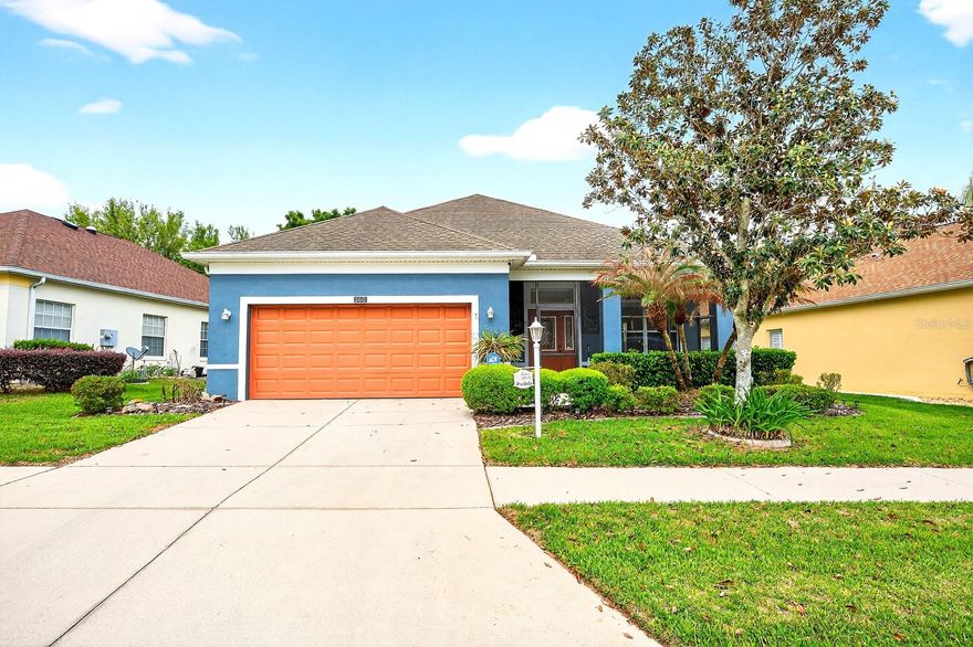 One or more photo(s) has been virtually staged. Seller may consider buyer concessions if made in an offer ~ Welcome to easy Florida living in the highly desirable 55+ community of Plantation at Leesburg ~ Glendale Village, ideally located just 1.5 miles from The Villages and all the shopping, dining, entertainment, and golf the area is known for! Set within one of Lake County’s most AMENITY RICH ~ ACTIVE ADULT COMMUNITIES with a lower HOA than The Villages, this MOVE-IN READY single-story home offers a practical layout, no carpet, and a peaceful backyard setting designed for relaxed everyday living. Step inside to a light and OPEN FLOOR PLAN with WOOD LAMINATE FLOORING throughout, creating a clean, modern feel and easy maintenance. The spacious living area at the front of the home flows naturally into the dining space and into the eat-in kitchen, making the layout ideal for both entertaining and comfortable daily living. The kitchen is well equipped with a breakfast bar, pantry storage, pendant lighting, and all appliances included, plus the garage refrigerator and freezer for added convenience. One of the standout features of this home is the FLEXIBLE OFFICE with double doors, perfectly positioned in the center of the home. This versatile space can easily function as a home office, hobby room, guest space, or a potential THIRD BEDROOM depending on your needs. The PRIMARY SUITE is tucked away at the back of the home for added privacy and offers a WALK-IN CLOSET and a private en-suite bath. A second bedroom at the front of the home sits next to the second full bathroom, creating a comfortable split layout that works well for guests. Out back, enjoy true Florida INDOOR/OUTDOOR LIVING from the SCREENED, TILED LANAI overlooking a lovely backyard view. The outdoor space is ready to enjoy from day one with the HOT TUB and BBQ grill included with the home, making it perfect for relaxing evenings or entertaining friends and neighbors. Additional highlights include extra storage in the garage, all appliances included, laminate floors throughout with no carpet, cheerful curb appeal, and mature landscaping that enhances the welcoming feel of the home. Residents of Plantation at Leesburg enjoy an exceptional lifestyle with two GOLF COURSES, an on-site RESTAURANT, resort-style POOLS, fitness centers, tennis and pickleball courts, clubhouses, and a full calendar of SOCIAL EVENTS and ACTIVITIES, all within a beautifully maintained GATED COMMUNITY. Best of all, you are just minutes from The Villages while enjoying lower HOA fees and a quieter neighborhood setting. If you are searching for a move-in ready home in a vibrant Central Florida 55+ golf community with fantastic amenities and a flexible layout, this Plantation at Leesburg gem is ready to welcome you home!