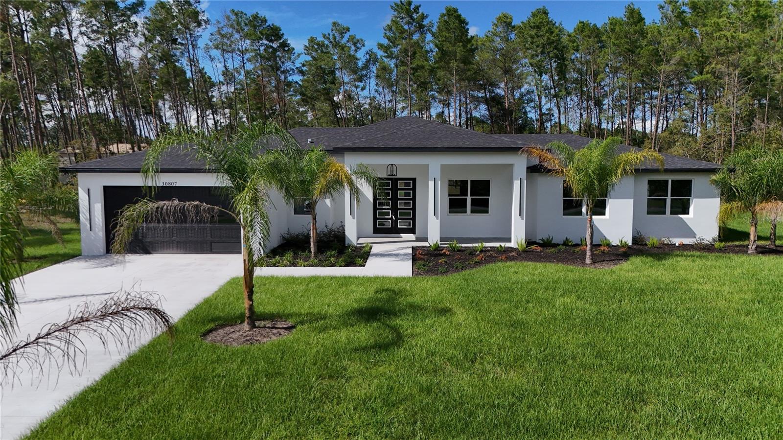 Under Construction. New Construction. Completion date is less than 30 days. Luxury Home with impressive 14 foot ceilings, 4 Bedrooms, 2.5 Bathrooms. 1 acre lot. Master Bath includes separate tub and a walk in shower with 2 rainfall shower heads. Royal Trails community surrounded by Seminole State Forrest. Come live in the country with the deer and wild turkeys. Horses allowed. Community is only 12 minutes to Publix, and 13 minutes to Wekiva Parkway/SR429. Clubhouse/playground. Community boat ramp to private 1,200 acre Lake Norris. HOA fees only $95 a year. Paved, county maintained roads. No manufactured homes allowed.