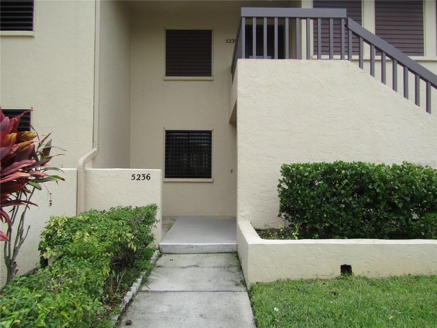 This cozy ground floor 2 bedroom 2 bath condo located in the "Heart of The Meadows" is move in ready.  The property is light and bright with new vinyl flooring and has been totally repainted.  The glass enclosed lanai overlooks one of many of the lakes in this Golf Course Community.  The Meadows is a vibrant golf community with many activities including a fitness center, walking trails, golf and pickleball.  The Renaissance program is available to annual residents so you will be able to enjoy the many activities of this active community.  Close to I-75, the UTC Mall, downtown and the beaches.  This property is a NO SMOKING unit and the owner prefers no pets.