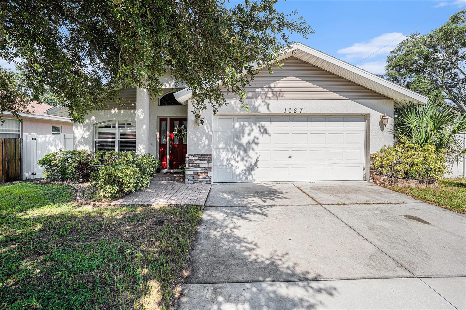 This exceptionally well-built, newer construction home is designed with a very practical and appealing layout, all situated in a highly desirable location. This 3-bedroom, 2-bath residence boasts vaulted ceilings throughout, creating a spacious and open feel. The kitchen is a true highlight, featuring elegant granite countertops with a stylish glass backsplash. You'll also appreciate the durability and beauty of the engineered mahogany floors in both the living and family rooms. For convenience, there's a separate laundry room. The owner's suite is a private retreat with a walk-in closet and an en suite bath. Additional features include double-pane windows for energy efficiency, a jetted tub in the main bath, and a fully fenced rear yard, perfect for privacy and outdoor enjoyment. Best of all, there's no HOA or CDD, and no flood insurance is required, which offers significant savings and peace of mind. The home is centrally located near Largo's Medical Mile, as well as highways 686 and 688, providing easy access to amenities and transportation. It's also just minutes away from Central Park, Historic Downtown Largo, the Largo Mall Shopping District, local bike paths, and the beautiful Gulf Beaches.
