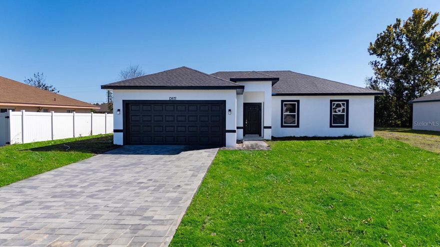 Welcome to this stunning new construction home located in the desirable community of Marion Oaks. This modern single-family residence offers 1,503 square feet of heated living area and 1,945 square feet total, featuring an open floor plan with four spacious bedrooms and two well-appointed bathrooms, providing ample room for family and guests.

The contemporary kitchen is the heart of the home, complete with stainless steel appliances, an inviting island, abundant cabinet space, and elegant granite countertops. Granite finishes extend into the bathrooms, while durable vinyl flooring throughout ensures easy maintenance and everyday comfort.

Additional highlights include a two-car garage, central heating and cooling, and a convenient laundry closet. Ideally situated in Ocala, this move-in-ready home blends modern style with functional design.