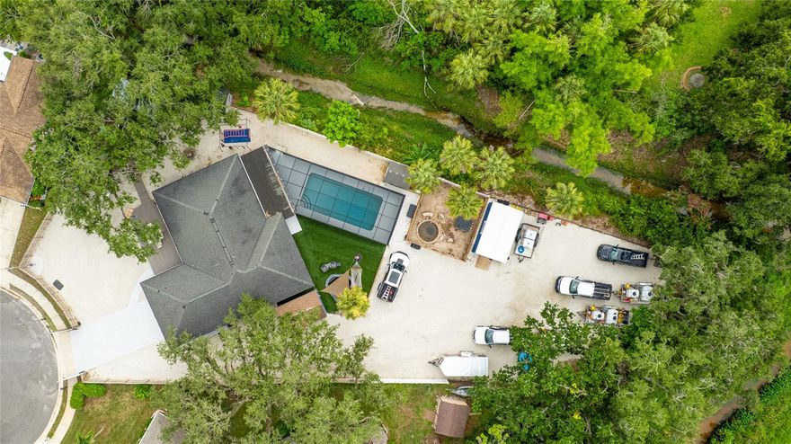 Welcome to 3200 Spainwood Drive, a 5 bedroom, 2 bath home and rare opportunity to own a versatile, income-producing property on nearly half an acre in the heart of Sarasota.

What truly sets this property apart is the flexibility and opportunity it offers. Currently operating as a Airbnb, this home is perfectly positioned for rental income, multi-generational living, or a home-based business. With no HOA restrictions and ample space, the possibilities here are wide open—something increasingly hard to find in central Sarasota.

The home offers approximately 2,200 square feet under air with a layout designed for both privacy and functionality. One of the bedrooms includes a private entrance, making it ideal for a guest suite, in-law quarters, or a separate rental space—adding even more income potential.

Inside, you’ll find a bright, open living space with updated plank tile flooring, abundant natural light, and a well-appointed kitchen complete with stainless steel appliances, generous cabinetry, and views of the expansive backyard. The flexible floor plan flows seamlessly to multiple outdoor access points, enhancing both everyday living and guest experience.

Step outside and you’ll immediately see why this property performs so well as a short-term rental. The outdoor space is designed for relaxation and entertainment, featuring a screened-in pool, spacious lanai, multiple covered lounging areas, and a tranquil koi pond. The fully fenced yard creates a private retreat, while additional detached structures provide space for storage, workshops, or creative use—ideal for owners, guests, or business needs.

Location is another major advantage. You’re just minutes from downtown Sarasota, shopping, dining, and the world-famous Gulf beaches. This central location makes it highly attractive for both full-time living and short-term rental guests.

Additional highlights include a newer roof, high-and-dry positioning (not in a flood zone), ample parking, and full usability of the entire half-acre lot—something rarely available in this location.

Whether you’re looking to expand your investment portfolio, run a home-based business, or secure a property that offers both lifestyle and income, 3200 Spainwood Drive delivers on all fronts.

Schedule your private showing today and explore the full potential of this one-of-a-kind Sarasota property.