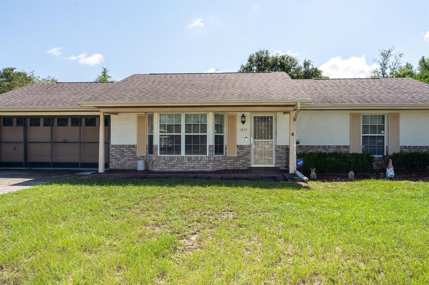 Here is a "must see" opportunity to live in a prime neighborhood in Deltona Lakes. This lovely 3-bedroom, 2-bathroom home offers an array of advantages. Cross the threshold into a living space you'll enjoy every day. Peaceful primary bedroom that you can access the large screened in lanai through. The other two bedrooms are ready for styling with a credit provided by the seller for new carpet! Attached two-car garage. A screened back porch is a great spot to relax. Schedule your showing today before this gem is gone! ;Water: City