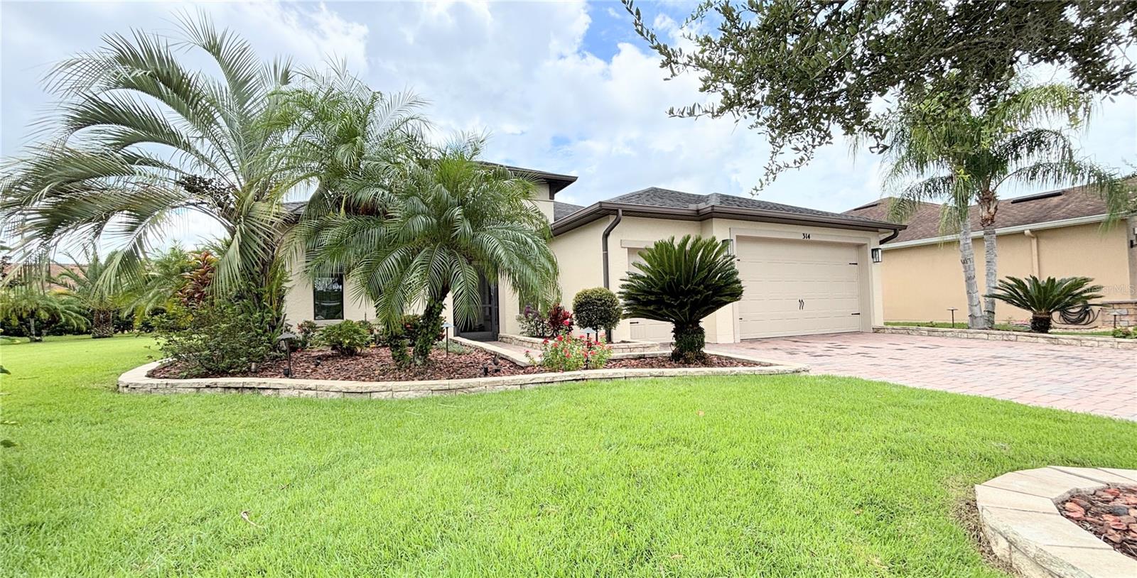 SPECTACULAR Home LOADED WITH UPGRADES. This JACKSONVILLE Model w/ 2 PRIMARY SUITES built in 2013 on a cul-de sac & oversized lot in the Vizcaya subdivision of Solivita will not disappoint! HVAC new in 2023. Marble-look LUXURY VINYL FLOORING in the main living areas in 2024. Upgraded Carpet in bedrooms & TILE in laundry room & Primary Bathrooms. The Kitchen features QUARTZITE counters, SUBWAY tile backsplash, STAINLESS STEEL appliances, 42" upper cabinets with CROWN MOLDING & LIGHT RAILS, SOFT-CLOSE doors & drawers, PULL-OUT drawers in lower cabinets, RECESSED, PENDANT & UNDER CABINET lighting & a closet pantry. This home boasts TWO PRIMARY SUITES with ENSUITE BATHROOMS, WALK-IN CLOSETS and BUILT-IN DRAWERS w/ GRANITE COUNTERS in each Suite! DUAL VANITIES with a Shower in one bathroom & Tub/Shower in the other suite. COMFORT HEIGHT Commodes. PICTURE WINDOW in Primary Suite #2 new in 2023. 3rd Bedroom w/ full bath nearby. Flex Room can be used as you see fit. 8' doors, 5.5" baseboards & rounded corners throughout. CENTRAL VACUUM & WHOLE HOUSE KINETICO water softener system. ENERGY EFFICIENT with ICYNENE spray foam insulation in attic ceiling & Double Pane Low E windows throughout. Room Darkening PUSH-PULL Levelor window blinds with an ACCORDIAN blind across the slider in the Great Room. CEILING FANS throughout home. Front Landscaping is upgraded with STONE PAVERS around the flower beds, red rocks in flower beds & and EXPANDABLE "VOLT" landscape lighting system. Built-in SURROUND SOUND SPEAKERS in Great Room & Lanai. Laundry Room has a SINK, cabinets & counter space. HUGE EXTENDED, SCREENED & Partially Covered LANAI looking out to the landscaping with over 20 palm trees which provides complete privacy. 2 CAR GARAGE plus an attached GOLF CART GARAGE. **See the FULL LENGTH VIDEO on Tour Link 1.** ***Solivita is an active adult 55+ community located in Kissimmee, Florida. It is approximately 50 minutes from Disney World & the Orlando International Airport. Solivita has a total of 5,470 homes. Approximately 10,000 - 11,000 people live in Solivita during the winter while approximately 7,500 live in Solivita during the summer. Enjoy your active years in this piece of paradise. Solivita's amenities include: - a manicured SOFTBALL diamond & field - 36 holes of CHAMPIONSHIP GOLF that can be played by joining the Stonegate Golf Club or paying as you go - 2 STATE of the Art AMENITY centers with updated exercise equipment, yoga studio & meeting rooms - 3 restaurants - 14 HEATED POOLS - 17 PICKLEBALL courts - 9 TENNIS courts - 4 BOCCE BALL courts - 4 SHUFFLEBOARD courts - 3 HORSESHOE pits - a BILLIARDS room - miles of bike paths - 2 DOG PARKS (Small & Large Dogs) - Corn Hole - Tot Lot PLAYGROUND - COMMUNITY GARDEN - over 250 resident clubs. The HOA: - maintains the LANDSCAPING & IRRIGATION systems in the common areas as well as at individual homesites - PROVIDES SECURITY with gate guards and mobile patrols including the Polk County Sheriff - allows AUTOMATED GATE ACCESS for residents via license plate readers - provides residents with Fiber Optic Internet & TV service.***Poinciana Lakes Plaza is a MAJOR NEW SHOPPING CENTER that opened directly across from the Solivita Main Gate in Summer of 2024. It features Sprouts Grocery, TJ MAXX, Ross, Burlington, Rack Room Shoes, 5 Below, Ulta, Outback, First Watch, 5 Guys, Urgent Care, Dentist, TD Bank, Petco & Hair Cuttery PLUS MORE TO COME.***
