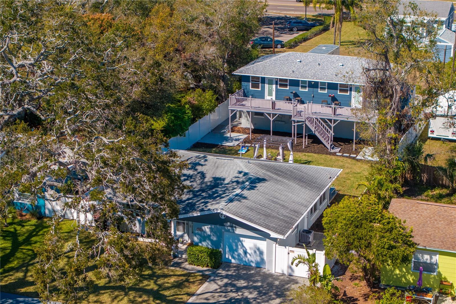 Attention investors and Gulfport Enthusiast! This unique property located in an Non Flood X Zone is walking distance to all the fun and fabulous Gulfport has to offer. It can serve as a perfect opportunity to expand your portfolio with potential short or long term tenants or can be an excellent location for multi-generational living. This unique purchase includes: 60 X 175 ft lot including a beautifully maintained CBS Main House 2 bedroom with a 408 sq ft garage, the rear building currently includes 2 -1 bedroom units or easily combined into 1- 2 bedroom 2 bath unit. $$$$ Additional 1056 sq ft 4 car garage with 2 sets of washer/dryer hook ups and 2 additional storage rooms for those that treasure safe haven for their cars, boats, or need that extra space for hobbies and projects. Alley access makes the ingress/egress super convenient too! This property is ideally situated near the quaint independently owned boutiques, dining, and the Gulfport Beach and Marina. Zoned as a duplex due to the size of the parcel, income potential and location you won't want to miss!