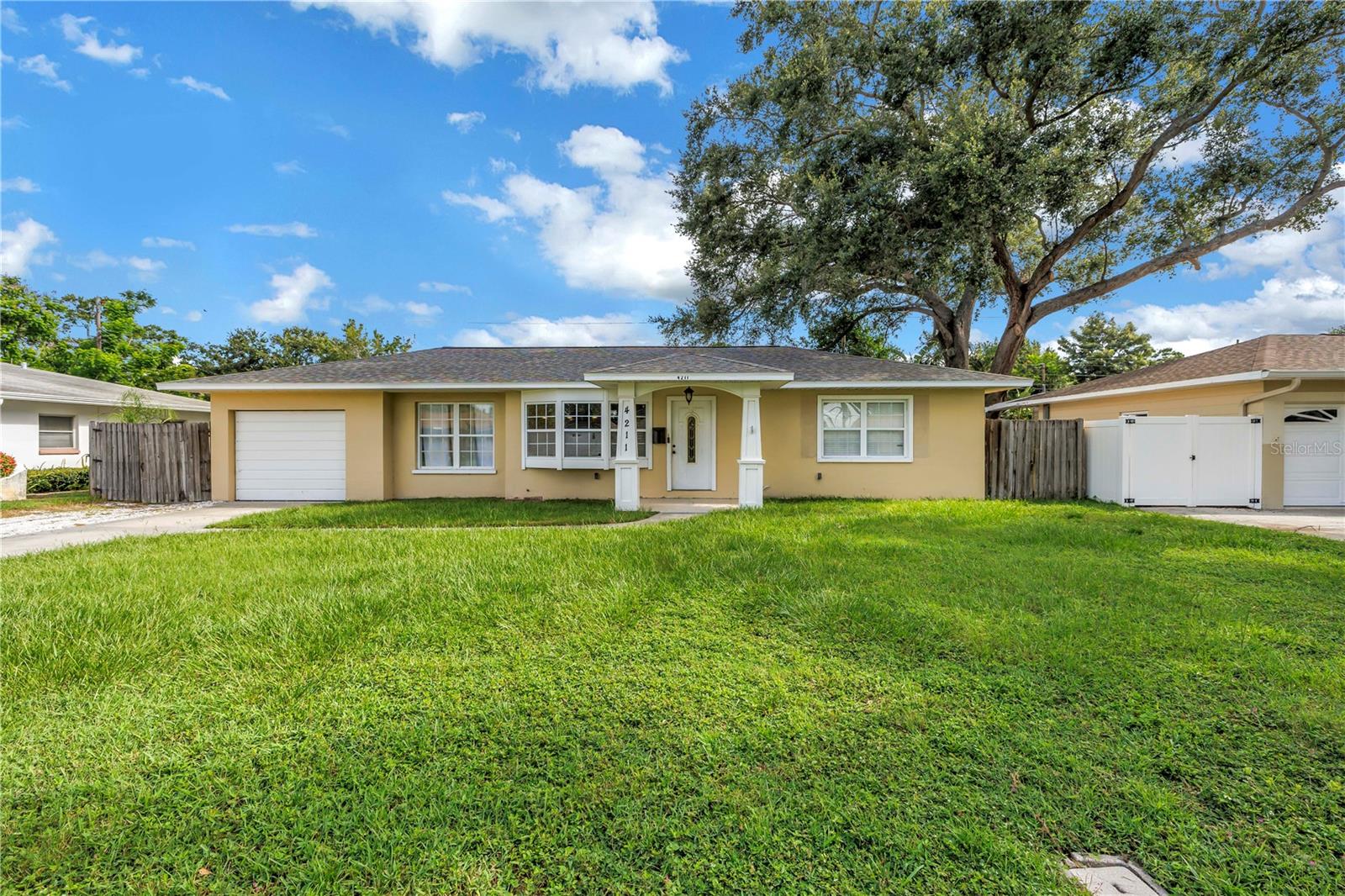 LOOKING FOR SPACE, A GREAT LOCATION AT AN INCREDIBLE PRICE? Bring your PERSONAL TOUCH to this 4-bedroom, 3-bath, 1-car garage home in the heart of Harshaw. The main living and dining areas are open to the kitchen, making it perfect for entertaining or just hanging out. The kitchen has tons of storage and new lower cabinetry and quartz countertops with a large bar seating area that is perfect for gathering with friends and family. One of the standout features is the interior in-law suite, complete with its own kitchenette and private entrance. It’s an ideal space for guests or multi-generational living situations. Just a short stroll to Leslee Lake, where you’ll meet friendly neighbors and lots of happy dogs—it’s a great place to unwind and feel part of a community. This home has an unbeatable location, versatile layout and is priced to sell quickly, so don’t wait too long to check it out!
