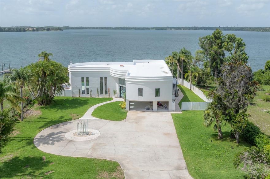 Great opportunity to live on the largest natural lake, 839 acres Lake Thonotaassa surrounded by multi million dollar home sites, Conveniently located with short distance between Tampa and Orlando. This beautiful lake home features 3.18 acres of land and 120ft of Lake frontage .This home features high ceilings, Beautiful lake views ,Private dock w/boat lift, Private pool, private tennis court and putting green. First floor features a grand foyer with built in fish tank, Formal living room with fire place and wet bar, Kitchen dining room combo, Family room, Home theatre, Fitness room and 2 full baths. Second floor features a loft with a built-in study and utility room. 4 bedrooms and 4 full bathrooms. This is a dream home schedule your showing today!!