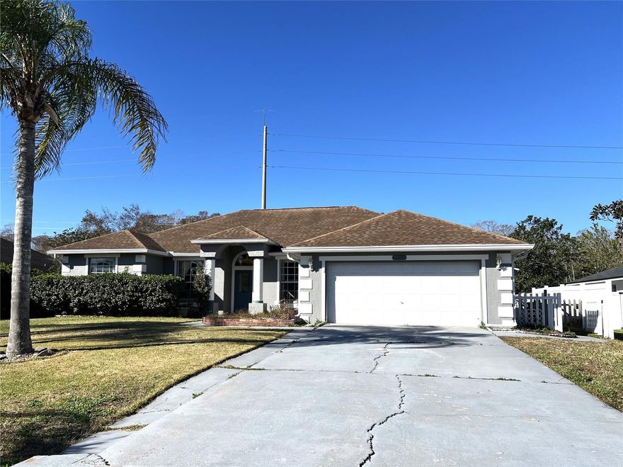 Very nice one-story 4 bedroom home with dual primary suites plus a home office. Situated on a one-third-acre lot on a cul de sac. Enter the home to see a large living room with crown molding, dining room to the right and French doors that lead to the office on your left. The kitchen features a high breakfast bar, solid surface counters, and all appliances will stay. The primary bedroom features a walk-in closet, and private bath with granite-topped vanity, jetted garden tub, and step-in glass tiled shower. This bedroom exits to the huge enclosed back porch. The second bedroom also has a full private bath. Bedrooms 3 and 4 share the 3rd full bath. Three of the bedrooms have painted concrete floors, ready to receive the floor covering of your choice. The inside laundry room has a utility sink for convenience. From the living room, go through the sliding glass doors to the enclosed porch, with view to the concrete patio, perfect for the BBQ, and the fenced back yard. There is a potting shed and a storage shed/workshop with a concrete ramp and electric power. The home is on city water and septic, to keep your water bill low. HOA is only $200 per quarter and there is no CDD here. The roof was replaced in 2018. The home is priced to sell AS-IS.