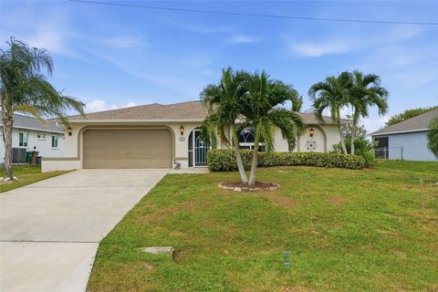 Photo of 1411 NE 19th Terrace, Cape Coral, FL 33909 (MLS # TB8441704) Photo of 1411 NE 19th Terrace, Cape Coral, FL 33909 (MLS # TB8441704)