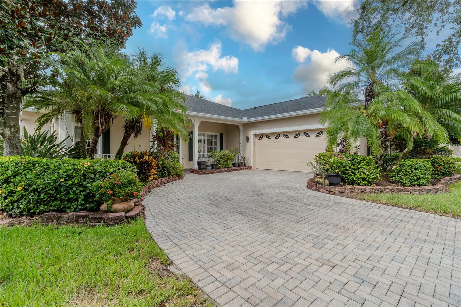 Welcome to Slovita, an award-winning 55+ community where tranquility meets elegance! This meticulously maintained Mozart model by Taylor Morrison offers three spacious bedrooms and 2 ½ baths, nestled within beautifully landscaped grounds. Step into a world of comfort as you’re greeted by a covered front porch leading into a formal dining and living area, seamlessly flowing into an open-concept kitchen—truly the heart of the home—boasting granite countertops, a breakfast bar, and an inviting eat-in space. Enjoy the abundant natural light streaming through the sitting room’s bay windows and retreat to the large primary bedroom, complete with a huge walk-in closet and an ensuite featuring a luxurious soaking tub, large stand up shower and double sinks. The new roof (2024) and fresh paint complement the updated AC (2020), ensuring peace of mind. Relax in your screened lanai overlooking lush gardens, and embrace the community's vibrant lifestyle with access to the Stonegate Golf Club’s 36 holes, community pool, and delightful restaurants, all set within 3,300 acres of pristine wetlands and woodlands. Discover your dream haven today!