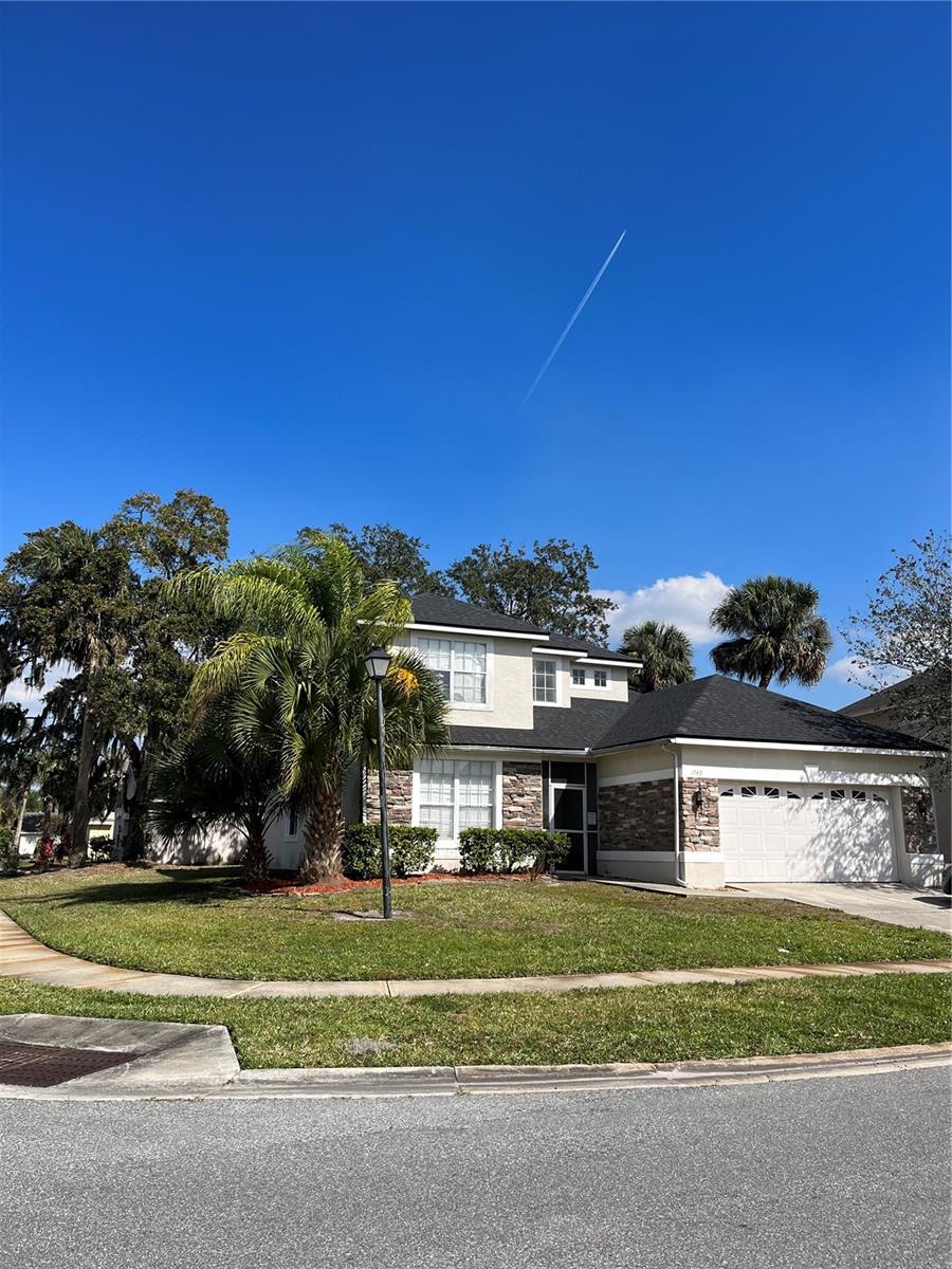 4 bedroom, 3 bathroom for rent. Perfectly positioned over sized corner lot on Golf View Drive in the tranquil Oaks in Kissimmee. Enter in to a spacious open formal living room with new plank tiling flooring. Flowing to the left a second living room, and open oversized concept kitchen with large breakfast room area. This home has a formal dining room perfect for entertaining family and friends. The kitchen enjoys stainless steal fridge freezer, and oven. Marbleized granite counter tops offering extensive counter space, wooden cabinetry and recess lighting. The living area flows out to a screened in porch. Flooring is tiled throughout entire downstairs. High vaulted ceilings in stairway displays tremendous natural sun light. Retire in the evening to your spacious newly tiled master suite with over sized tub, and huge walk in closet which is on the first floor. The house enjoys granite surfaces in every bathroom. Home comes with powder room, utility area, and two car garage. Staircase, upstairs landing walkway, and 3 large bedrooms upstairs have all enjoyed new wall to wall fitted carpet November 6th 2020. The bath in the upstairs bathroom has been remodeled October 31st 2020. The roof was replaced November 5th 2020. Ac unit replaced 2018. The exterior painted March 2019. Home newly painted throughout the home. The community boasts its own boat ramp, where you can take your boat out when relaxing, and tennis courts that are lit up for night games. Enjoy a round of golf on the Oaks National Golf Club, and visit the golf pro shop, cafe, and refreshments, or take a golf lesson and practice on the golf range. The Oaks community enjoys a collection of holiday entertainment, from Easter egg hunts, to festivities at the Holidays, as well as food trucks periodically. A wonderful community. Come see today.