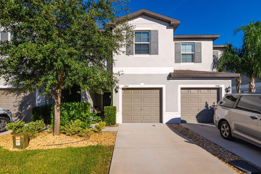 Welcome to this beautifully maintained 3-bedroom, 2.5-bath townhome in a gated Lutz community, offering comfort, convenience, and a peaceful setting. Built in 2021, this two-story home features a bright, open layout with tile flooring throughout the first floor and a spacious kitchen with white shaker cabinets that flows seamlessly into the family room and dining area—perfect for everyday living and entertaining.
Upstairs, you’ll find a thoughtful layout with all three bedrooms, a convenient laundry room (washer and dryer included), and an open loft ideal for a home office or study space. The primary suite includes an ensuite bathroom and a generous walk-in closet, while the two additional bedrooms share a well-appointed bath. Step outside to a screened-in patio overlooking a serene conservation area, offering a private outdoor retreat. Additional highlights include a one-car garage with an opener, low HOA fees, and no CDD fees. The HOA covers exterior maintenance, landscaping, and access to the community pool. Situated in a top-rated school zone with quick access to SR-54, I-75, and I-275, this location places you near shopping, dining, medical facilities, and plenty of local activities. This home blends modern living with a prime location—come see it in person to truly appreciate all it offers.