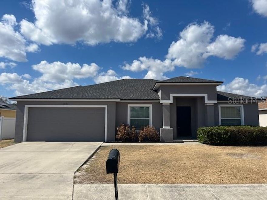 This 4 bedroom, 2 full bath home has three way split floor plan. The first bedroom as you enter the home could also be used as a den/office. The two bedrooms off the main living area on the right have a full bathroom between them and the primary bedroom is on the opposite side of the living room, which provide flexibility for family and guests. The large eat-in kitchen has granite countertops, all appliances, and passes through to your spacious dining and living room for that bright, open feel. The living room area has double sliding glass doors opening to the large, vinyl clad fenced-in backyard, for you and/or pets enjoyment. There are numerous feature walls with built-in nooks in the hallway and guest bathroom as well as cut out shelving above the living/dining room area, which add both charm and art niches. The large primary bedroom offers plenty of room and includes a sitting area, a generous 9x10 walk-in closet, and an en-suite bath featuring an extra-large soaking tub. This is looped neighborhood roadway with a low-key homeowner’s association. The shingled roof was replaced in 2022.