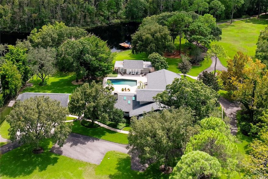 ***RARE OPPORTUNITY TO OWN A SLICE OF PARADISE IN THE MIDDLE OF EVERYTHING***Nestled into the landscape of East Lake walking distance to East Lake High lies a sprawling 4+ acre gem. Experience unmatched seclusion with the prime Palm Harbor location. This 5,452 sq ft Modern Farmhouse luxurious residence is a masterpiece of design & craftsmanship. Upon approach to 2801 Bryan Ln, you’re greeted by a long private driveway, flanked by the sparkling lake, heralding an atmosphere of nature. The interior boasts hand-scraped wood floors throughout, a river stone fireplace, remote Velux Skylights, Double Islands in the Kitchen with stone counters, a Viking Gas Range, a Sub-Zero Wine Refrigerator, Two master suites on the main floor, and a Separate Guest House. Additional features include a saltwater PebbleTec pool with an expansive Travertine patio, an outdoor kitchen area, a covered front porch to watch the deer grazing in the morning, and a back patio overlooking the lake. The property is manicured with an oversized 3-car garage that backs up to Cypress Lake Estates but with no HOA. This is the rare opportunity to own a slice of paradise in the middle of everything, making 898 Cypress Lakeview Ct not just a home, but a treasure to be cherished.  This home offers too much to list. Must See!! Roof 2019, 4 Trane HVAC Units 2016, 2018 2019, and 2021.