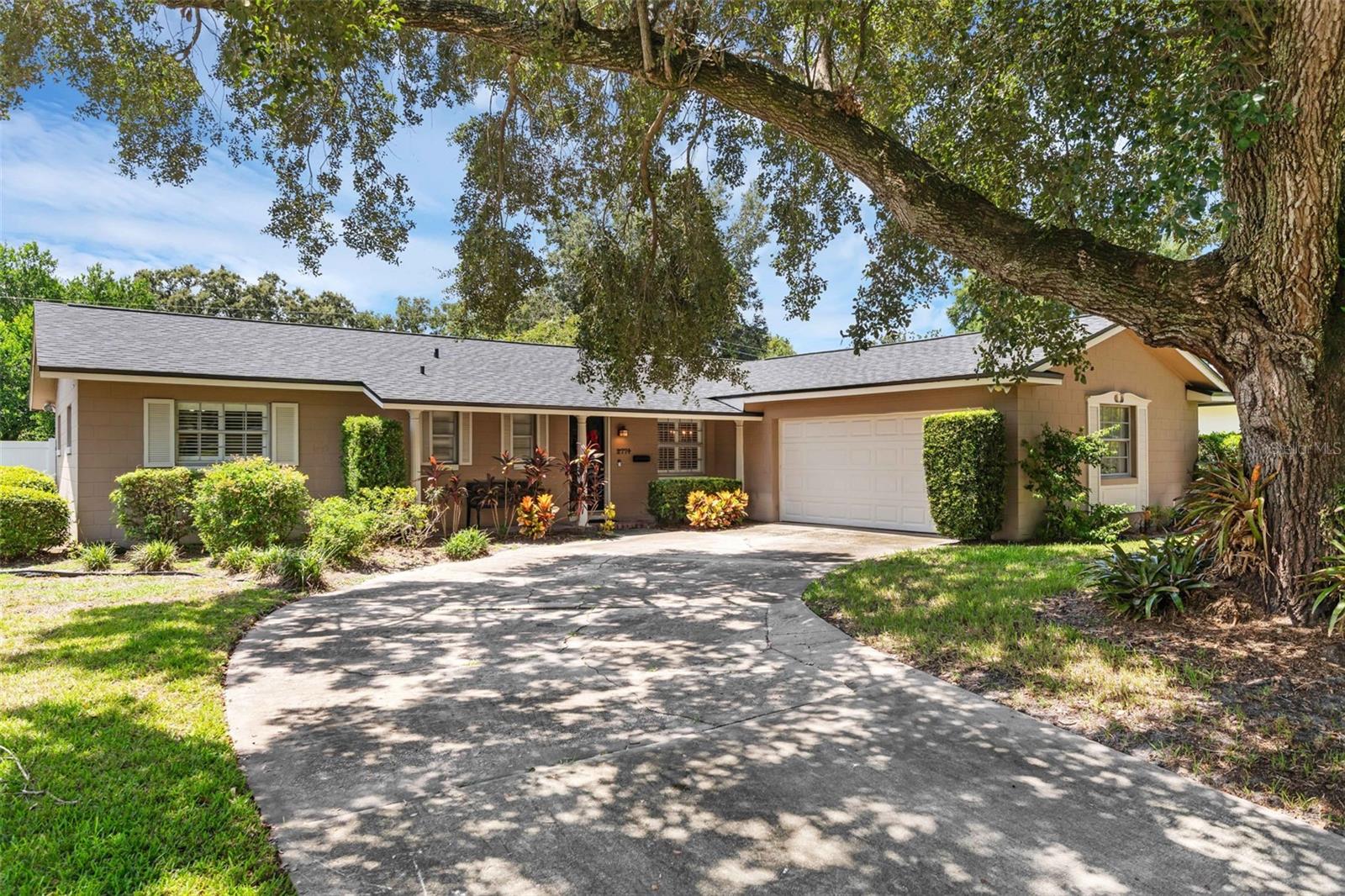 Welcome to this beautifully maintained 3-bedroom, 2-bathroom block ranch home in Winter Park Pines. Nestled behind a stunning mature oak tree, this home offers comfort, charm, and convenience in one of Central Florida’s most desirable communities. The large driveway leads to a 2-car garage ensuring plenty of space to park for you and your guests. Step onto the covered front porch and into a thoughtfully designed layout. A comfortable, open dining room and kitchen greet you just off the entryway to the right, perfect for hosting or everyday living. The kitchen flows naturally into the spacious living room with plenty of natural light, providing a warm and inviting gathering space. Down the hall, you’ll find an updated full guest bathroom with a shower/tub combo and two comfortable guest bedrooms. The private master suite is situated at the end of the hall, and offers an updated attached bathroom with a walk-in shower. Enjoy Florida living year-round in the screened-in back porch or relax in the private, fenced-in backyard—ideal for pets, family time, or entertaining. A newer roof (December 2023) offers peace of mind for the future. Windows throughout the home include beautiful plantation shutters. The home is situated in a sought-after school zone—including Winter Park High—and just minutes from Cady Way Trail, Ward Park, Cady Way Community Pool, Lake Baldwin Dog Park, Winter Park Pines Golf Club, and Park Avenue which offers shopping, dining, and entertainment. This home is ready for its next owners, so schedule your appointment today!