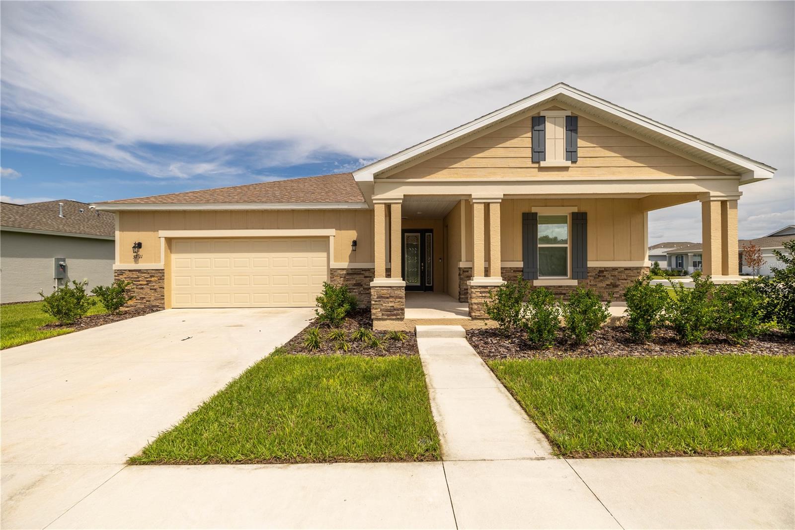 Larkspur Model in SORREL GLEN 1 | 4 BEDROOM 3 BATH | 2 CAR GARAGE | GREAT ROOM | DINING ROOM | FLEX ROOM | NEST IN KITCHEN | INDOOR LAUNDRY SUITE | COVERED AND SCREENED LANAI | TESLA CHARGER in garage. This fabulous home is designed for families and entertaining with a large open kitchen that features bar seating and a nest connected to the kitchen that features stone counters, a secondary dishwasher, a bar fridge, and a sink. The primary bedroom has a linen closet in addition to Hers and His walk-in closets, and the primary bathroom has Hers and His vanities and a walk-in shower. There is a bonus flex room in the living room area that could be used as a playroom, an in-home gym, or closed off to be used as a bedroom. The guest bedroom in the front of the home has its own exit door to the front porch and another door inside the house. The in-house laundry has an abundance of cupboards and counter space and a built-in sink. The blinds in the living room are electronic and open easily with the push of a button. The living room conveniently has an electrical outlet in the floor for plugging in devices in your seating area. The garage also has a bonus room under heat and air that could be used for a workshop, workout room, crafting, teen room for video games and hang out, man cave, etc. Large screened back porch and walking trails that are easily accessed from the back patio. Residents/Renters can enjoy 4 free passes for FAST swimming. Calesa also has walking paths with outdoor fitness equipment, Bark Parks for dogs, which have open spaces for off-leash fun, covered gazebos, a basketball court, playgrounds, a splash pad, a heated pool area, covered gazebos, and more. Come and enjoy resort-style living for families! PET FRIENDLY