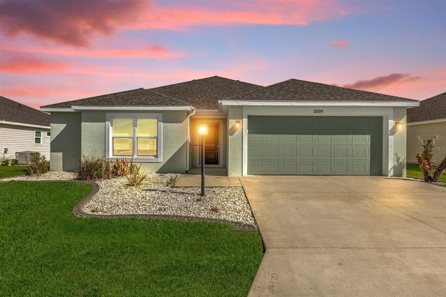 LOCATION LOCATION LOCATION - THE VILLAGE OF RICHMOND - TURNKEY - Just minutes by golf cart to Brownwood Paddock Square, this designer SEQUOIA 8 model home sits in one of the most sought-after corridors in The Villages—offering immediate access to nightly live entertainment, restaurants, and shopping as well as sports facilities and golf amenities. Less than one block away is the Richmond Recreation Center that includes a beautiful pool sitting next to a pond. What a view! There's also a dog park, shuffleboard, and bocce ball courts. Less than a block in the other direction is Clarendon Recreation Center featuring another beautiful pool on a pond, tennis, pickleball, beach volleyball, shuffleboard, and an outdoor exercise area. 2895 Osborne St is a 3bed/2bath home with an open floor plan. Built in 2022, it offers low maintenance with newer construction and appliances. This home features gas appliances including a GAS STOVE and a gas TANKLESS WATER HEATER. As the second owner you will also have access to the REMAINING WARRANTIES on the ROOF and the HVAC system. If you are considering an investment opportunity, properties this close to Brownwood consistently attract high seasonal and repeat rental interest. Offered turnkey, 2895 Osborne St is ready to generate income from day one with minimal setup required. A 2021 YAMAHA GOLF CART, available for purchase separately (see pictures), provides an added amenity that renters actively seek and are willing to pay a premium for. If renting is not your thing, just know this home is move-in ready and all you need are your personal belongings. Call today!! Don't miss out on this great opportunity to own in one of the best locations in The Villages.