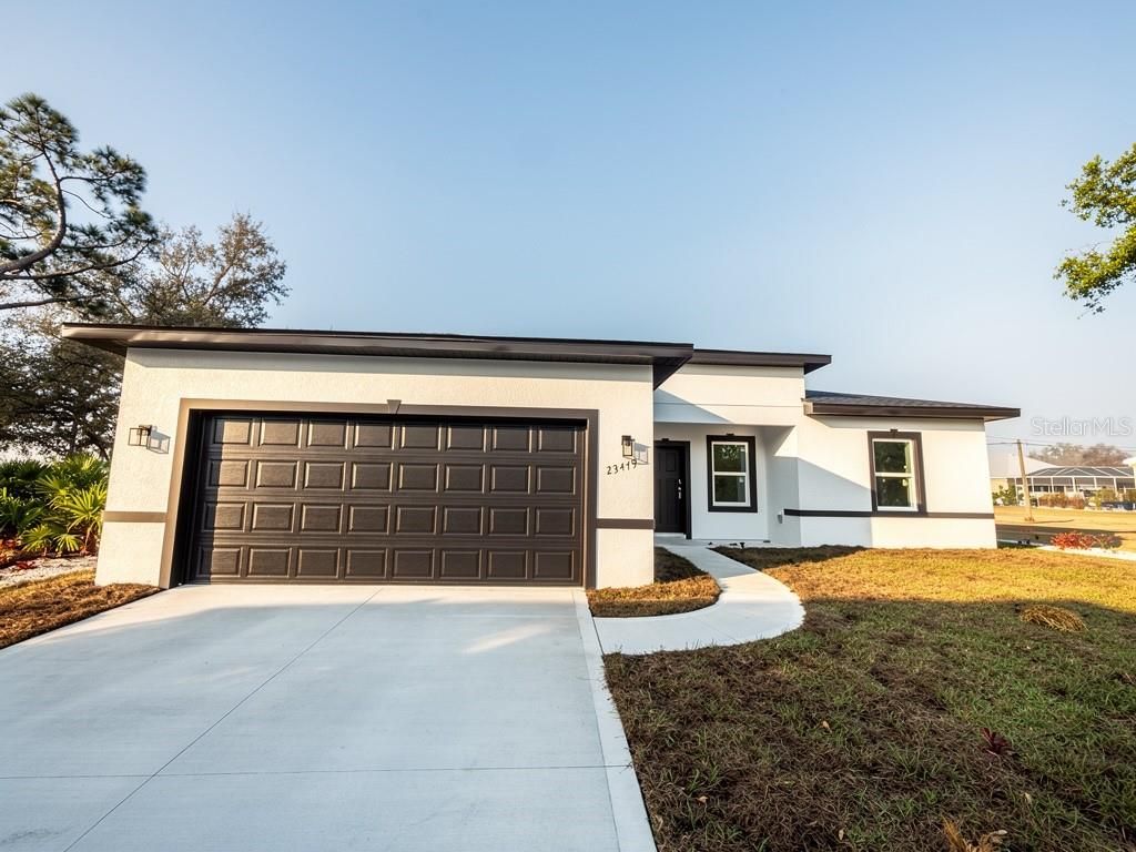 Photo of 23419 Gemstone Avenue, Port Charlotte, FL 33980 (MLS # O6382154)