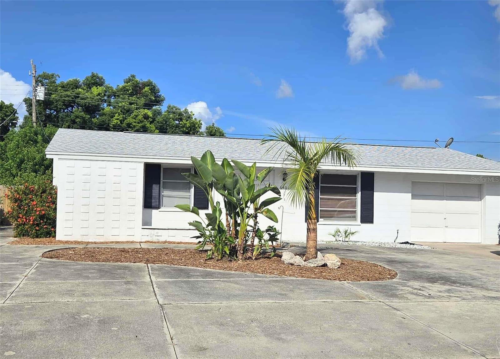 Wellcome to this beautiful Bayshore Gardens home! This 2bedroom 2 bath home has many features that will make you smile. Do you like ample parking space? The entire front is paved with driveways on each side. Like a large yard? This home offers a very large fenced private oasis. Prefer no carpets? This home has that too! Don't forget it is located in the sought after community of Bayshore gardens. Enjoy the amenities of an HOA, without deed restrictions! Bayshore Gardens offers its residents a wide range of social and recreational activities on the shores of Sarasota Bay. Included are a Jr. Olympic-size swimming pool, large pool deck/patio area, playground, picnic pavilions with BBQ grills, ball field, and fishing pier with cleaning station. A marina with a private boat ramp along with a recreation hall are available to our residents at reduced rates. They offer a renovated community hall that is great for weddings, anniversaries, graduations, birthdays and other celebrations and has a capacity of 224. Bayshore Gardens residents may rent a boat slip or the recreation hall for events. There are clubs to suit almost every interest including the Yacht Club, Garden Club, Woodchoppers Club, and other activities. Living here will be a dream, so make your appointment to see this home today!