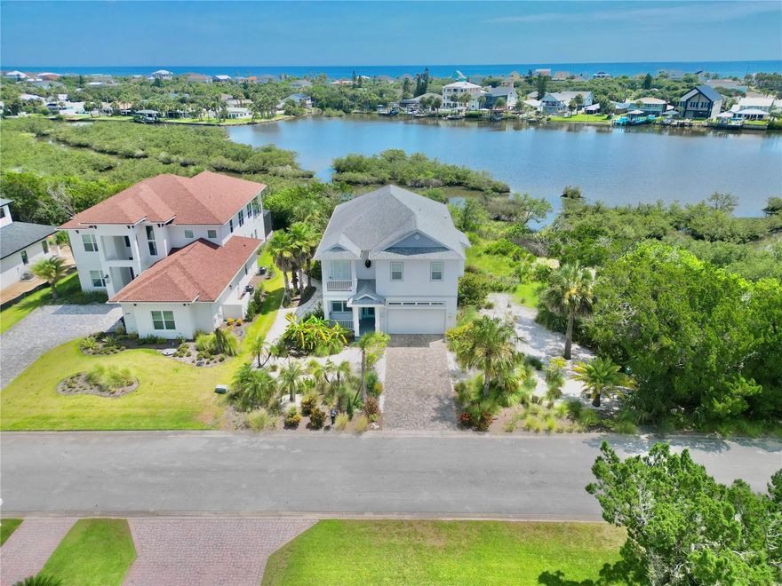 Welcome to this stunning custom-built luxury home located in the sought-after Cedar Island community of Flagler Beach. Built in 2018 this exceptional property offers the ultimate coastal lifestyle with sweeping waterfront views. Located directly on a deep salt water bay with access to the Intracoastal Waterway only 4 houses away, all leading to the Atlantic Ocean. Access is perfect for boating, fishing and water recreation. Ample space to build your own private dock.
Inside, you’ll find elegant tile flooring throughout and a spacious layout designed for both comfort and entertaining. The lower level features two generously sized bedrooms, a full bathroom, and a large living area—ideal for guests, family, or a home office setup. Upstairs, the open-concept floor plan includes a chef’s kitchen, dining area, expansive great room, and a convenient half bath for guests. The oversized master suite serves as a luxurious retreat, complete with stunning views.
Enjoy outdoor living year-round with large covered decks on both levels, each finished with stylish tile flooring—perfect for relaxing, dining al fresco, or soaking in the peaceful waterfront setting. Impact windows & doors throughout.
This Flagler Beach gem blends luxury, privacy, and convenience in one of the area's most exclusive waterfront neighborhoods. Golf cart friendly city. Homes like this are a rare find—schedule your private showing today and experience the best of coastal Florida living.