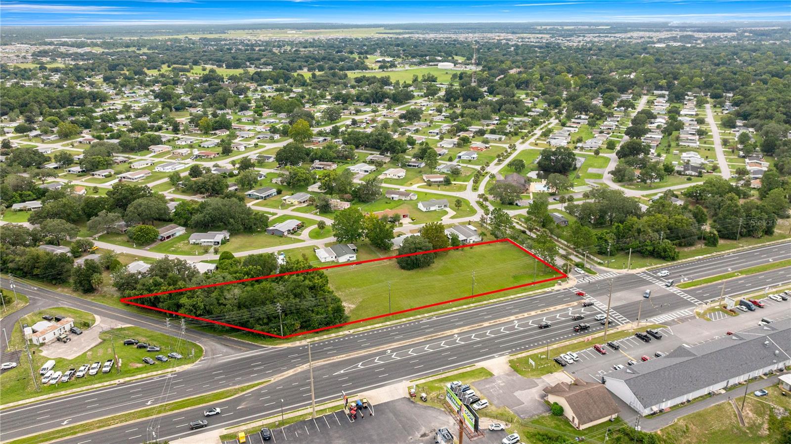 1.75 Prime Acres – Prime Development Tract in Ocala’s Fastest-Growing Corridor! Now available, this 1.75-acre vacant commercial parcel offers exceptional development potential in one of Marion County’s busiest corridors. With a prime location at the entrance to Pine Run Estates, an 800+ homesite community of site-built homes (no mobiles or modular), the access is unmatched for a ready-made large customer base! Zoned B-2, the property accommodates a wide range of retail, office, and service uses, making it an ideal choice for investors or businesses seeking maximum visibility. With excellent frontage on heavily traveled SW Highway 200, this site benefits from high daily traffic counts, strong surrounding commercial growth, and easy accessibility. Whether you’re planning a new retail center, professional office, or service-based enterprise, this strategically located property presents an outstanding opportunity in a thriving market.