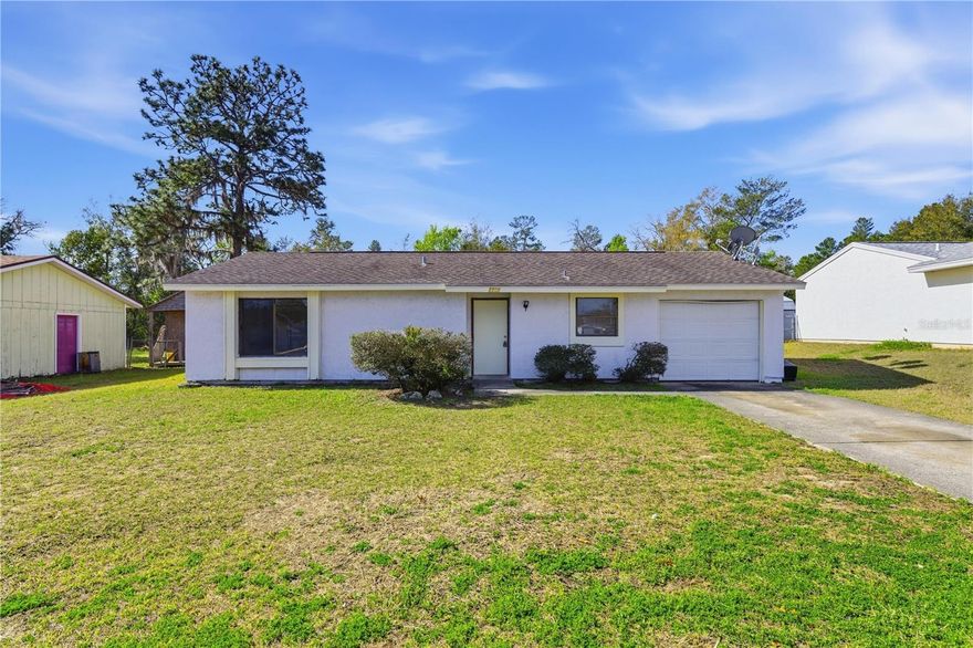 Located in Silver Springs Shores in Ocala, this concrete block home sits on a quiet residential street just minutes from the shopping, dining, and daily conveniences along SE Maricamp Road. The layout offers comfortable living space with tile flooring through the main areas, a practical kitchen with built in appliances, and an attached garage for storage and everyday convenience. Natural light fills the main living area, creating a bright and functional space for daily living. Out back, the fenced yard provides privacy and room for pets, outdoor gatherings, or future improvements. Silver Springs Shores remains one of the most active residential areas in Marion County thanks to its accessibility and proximity to Ocala, Belleview, and The Villages. Nearby parks, lakes, and outdoor recreation add to the appeal while maintaining quick access to major roadways. A well positioned opportunity in a growing area of Ocala.