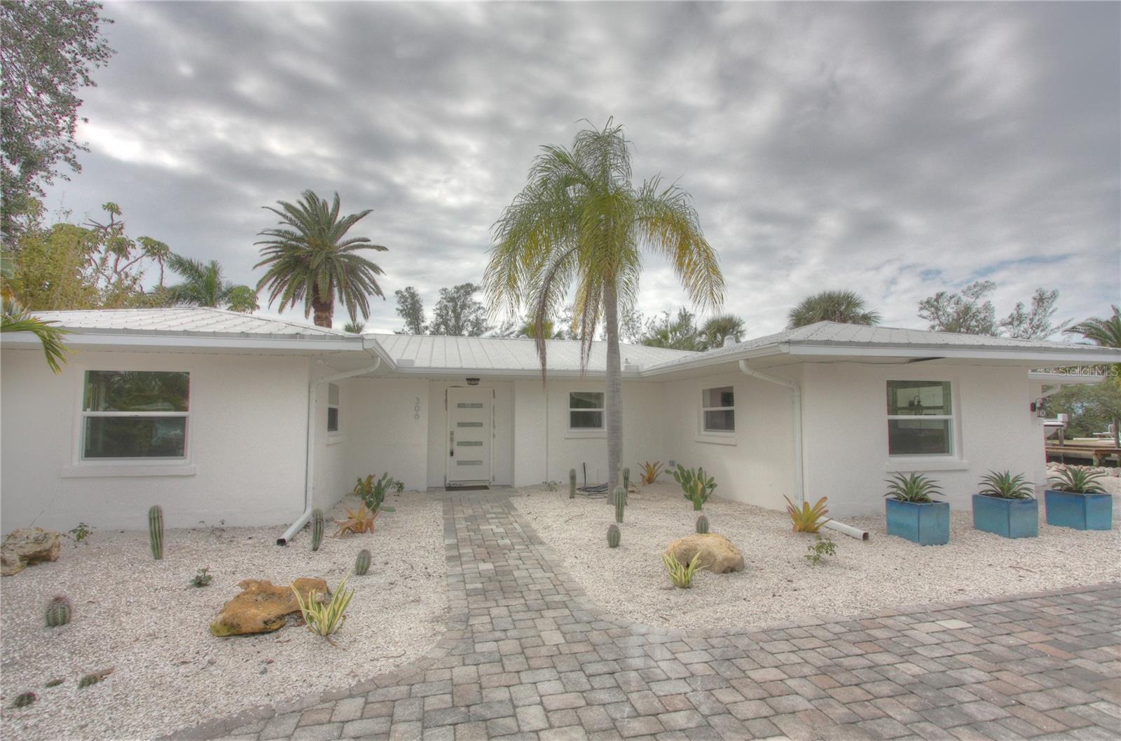 Available now. Lovely pool home with canal water frontage located in Siesta Key's peaceful and secluded neighborhood of Palm
Island. Completely renovated with new kitchen, bathrooms, and floor coverings throughout this island retreat. Walk four blocks to the crystal
sands of world famous Siesta Beach, and just a short walk to the Village. Beautiful backyard with spacious patio, heated swimming pool/spa and boat dock with lift.