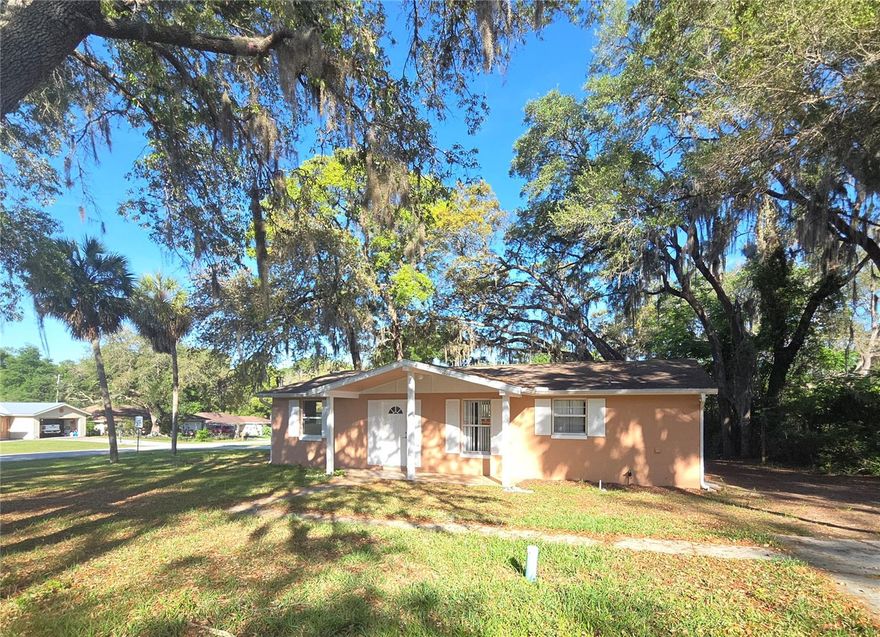 Charming and well-maintained 3-bedroom, 2-bath concrete block home built in 1975, ideally situated on a desirable corner lot just minutes from the beautiful Rainbow River and nearby scenic bike trails. This solidly constructed residence offers peace of mind and classic appeal, enhanced by fresh interior and exterior paint that gives the home a clean, updated feel.

Inside, you’ll find a functional galley-style kitchen designed for efficiency, with ample cabinetry and workspace to make meal prep a breeze. The layout flows comfortably into the living and dining areas, creating a welcoming space for everyday living or entertaining.

Each of the three bedrooms provides comfortable accommodations, while two full bathrooms provide convenience for family and guests alike.

The corner lot adds extra outdoor space, increased privacy, and excellent curb appeal, with plenty of room to create your own outdoor retreat. Enjoy easy access to kayaking, swimming, and nature, as well as peaceful rides along nearby trails—perfect for embracing the Florida lifestyle.

Whether you're a first-time buyer, downsizing, or looking for a solid investment, this home combines durability, location, and value in one appealing package.