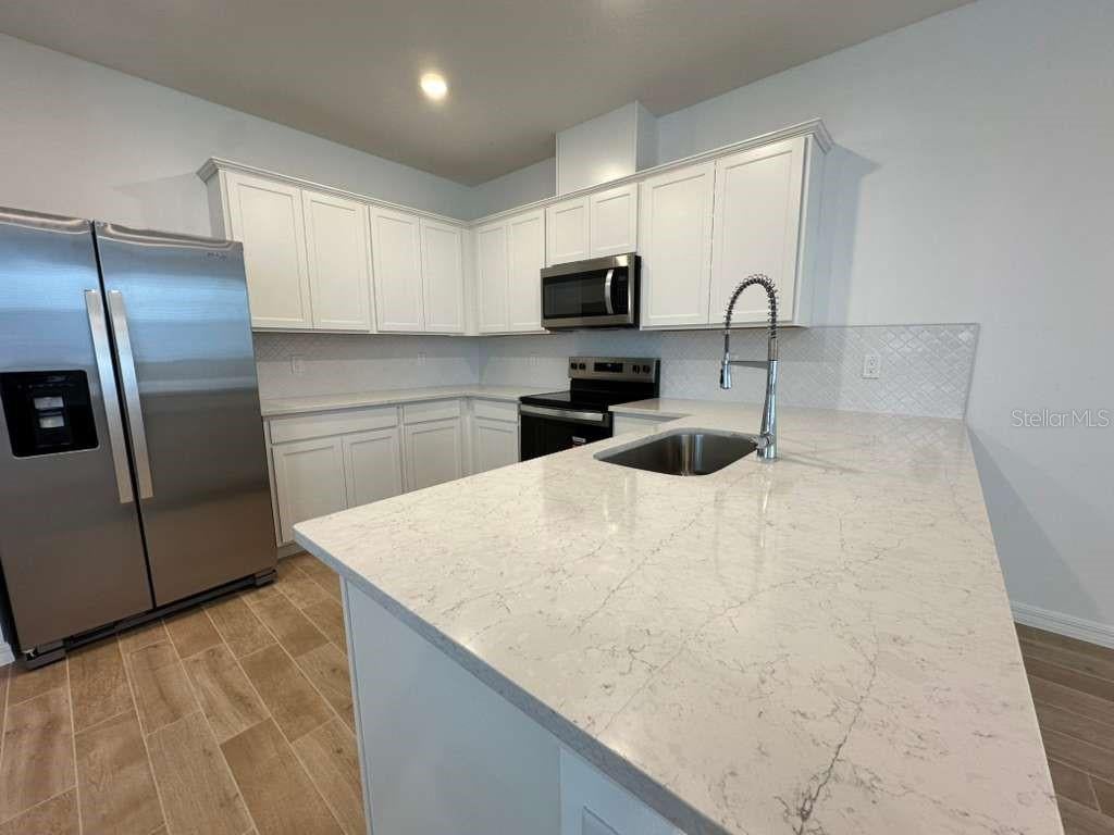 Photo of 4544 Orchard View Alley, Clermont, FL 34714 (MLS # O6438337)