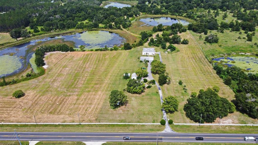 DEVELOPERS/BUILDERS--An Excellent Opportunity on this 73 +/- acres.  Highway 19 frontage of 1245 ft.  Adjacent to the new Mission Rise Community.  Close to Mission Inn. Three Large Ponds on site.  Possible 50-60 Homes for development.  In an area of Newer Homes.  Site Consists of 2 Homes.  One home was built in 1860 (1200 sq.ft.) 3/2 Master bedroom enjoys walk in closet and large bathroom.  Detached 2 car Garage. The other home was built in 1976 (1600 sq. ft.) 2/2 with 2 car attached garage.  Possible lot Split for family members to build homes and enjoy country life.  Large Workshop 60X60.  Shop has 2-220 Amps , 1/2 Bath, 6 Banks of Lights, 2 Lift doors.  2-AC Units.  Looking to start a Cow/Calf operation?  Site has beautiful pastureland.  Thinking of opening a Horse boarding or training facility.....Perfect location for access to major road with plenty of riding areas.  Peaceful and Quiet country.