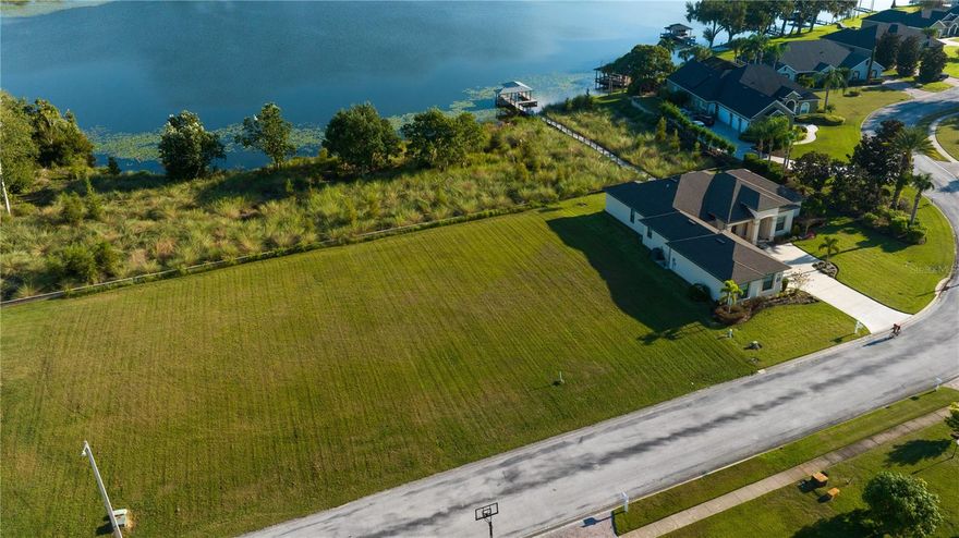 SOUTHEAST WINTER HAVEN! BUILD YOUR LAKEFRONT DREAM HOME ON THIS GORGEOUS LAKEFRONT BUILDING LOT IN THE GATED COMMUNITY OF MILLER'S LANDING WITH 100 FT. ON LAKE BESS! Views! Views! Views! Hurry before it's long gone!