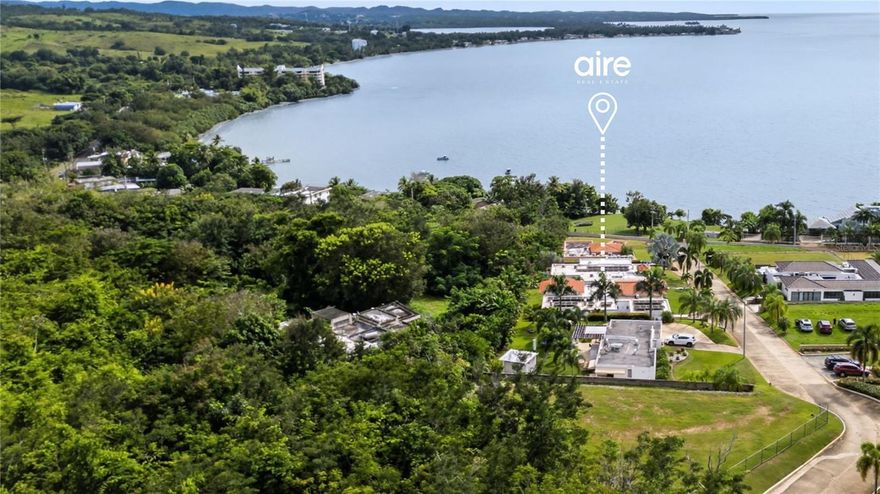 The community offers an elevated, resort-style lifestyle with a serene pool, well-appointed gym, elegant gazebo, and ample visitor parking. Short-term rentals are prohibited, ensuring a quiet and exclusively residential atmosphere. Set beside the Monte Pirata trail system, the property enjoys direct access to more than five miles of scenic biking and hiking paths that lead to secluded, untouched beaches. Its location—just 15 minutes from the region’s top schools, universities, and premier shopping centers—strikes the ideal balance between privacy and convenience. The residence is equipped with fiber-optic internet, a 15kW net-metered solar system, a 20kW diesel generator, a water cistern, and controlled access, offering comfort and resilience. Together, these features create a luxurious, secure, and effortlessly refined waterfront living experience.