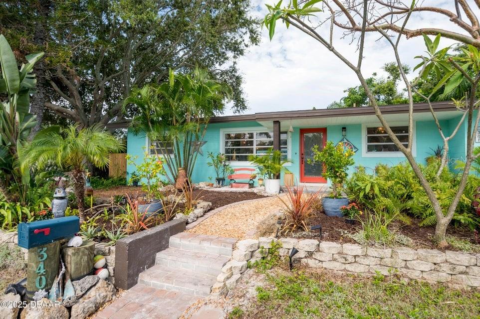 ***Multiple offers Received*** Please submit highest any offers by 12:00 PM, Monday, July 28th.
Mid-century charm meets coastal living in this elevated Dunedin bungalow! Located near Downtown Dunedin, enjoy quick access to restaurants, breweries, shops, festivals, the Pinellas Trail, and Gulf beaches. Features include original terrazzo floors, jalousie windows, a new roof (2023), and updated kitchen and baths. Flexible layout with 2 bedrooms, bonus room (ideal office or 3rd bedroom), and 2 baths—one in the oversized 2-car garage. Lush tropical landscaping in front; fully fenced backyard with xeriscaping, outdoor shower, and clawfoot tub. A rare opportunity in a prime location!
The flexible layout includes two spacious bedrooms and a bonus room ideal as an office, studio, or third bedroom. In addition to the main bathroom, a second bath is located in the oversized two-car garage, offering added convenience and versatility.
Outside, the property features lush tropical landscaping in the front and a fully fenced backyard designed as a low-maintenance retreat, complete with xeriscaped elements, an outdoor shower, and a freestanding clawfoot tuba serene space to unwind and recharge.
Whether you're searching for a full-time residence, seasonal getaway, or investment opportunity, 340 Socrates Drive delivers the very best of the Dunedin lifestylecomfort, charm, and community in one exceptional location.