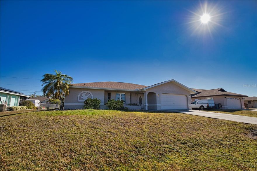 Beautiful 3 bed 2 bath 2 car garage, living, family room with fireplace, dining room and dinette.  Kitchen has a pass through to pool.  Sliders from family room, dining area and primary bedroom to the pool area and lanai. Ceramic tile throughout with carpet in bedrooms.  Wide open and spacious floor plan.  Back yard fenced for pets. Great central location, close to dining, shopping, golf coursed and beaches.