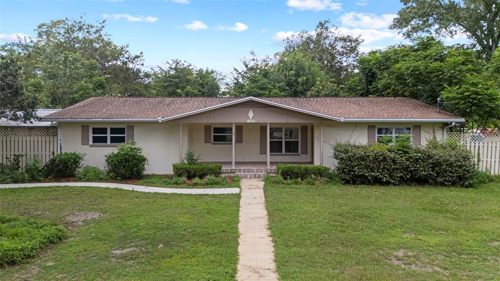 One or more photo(s) has been virtually staged. This 1-story home is located in the desirable Kingswood Acres community of Ocala. It offers 3 spacious bedrooms and 2 full baths, including a comfortable primary suite with its own bath. The home features a living and dining room combination, plus a kitchen with a dinette area and plenty of cabinet storage. Situated on a corner lot, the property includes a fenced yard, a large detached workshop/garage, and a screened patio for added functionality.
The home is being sold in as-is condition. Don’t wait—schedule your showing today before this opportunity is gone!
