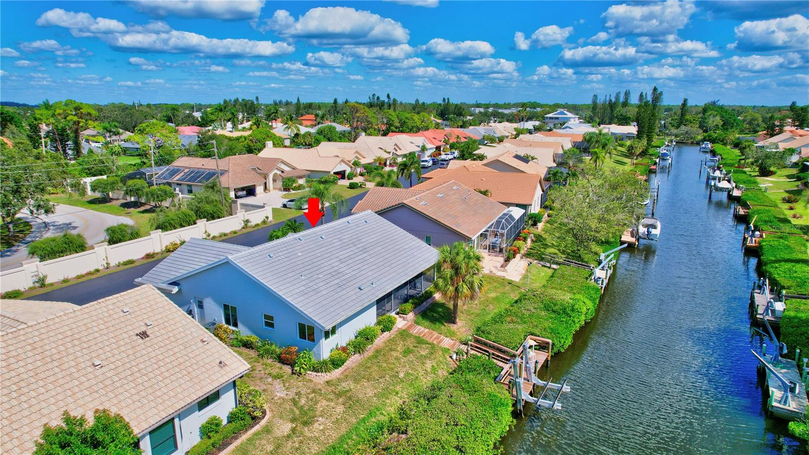 Welcome to the Best of Waterfront Living! New Roof, New Impact Windows and Doors, and New Appliances. This home has been Newly Painted inside and out. Outside you will find a New Dock and New 10,000 lb Boat Lift. Want more? This 3 bedroom, 2 bath light-filled home includes interior laundry room. The 3rd bedroom is currently being used as a den. Taken down to the studs in 2022, the upgrades begin at the Custom Front Door. There is Porcelain Tile throughout, all new spray-coated Interior Doors, 6” Baseboards and Vaulted Ceilings in all rooms, LED lighting throughout, and a New Electrical Panel. Still not enough? An Open Concept Kitchen was created with Solid Wood custom cabinets. There are Quartz Countertops with waterfall and full backsplash. There is plenty of storage along with a built-in storage bench that can be used for eat-in kitchen seating. Both bathrooms have been fully remodeled, and a walk-in shower and soaking tub are found in the primary bathroom. There are transom windows in the den and primary bedroom. This stand-alone condo includes cable TV, internet, ground maintenance, and community amenities in the monthly fee. The Inlets is conveniently located between Sarasota and Venice. There is a large-heated pool, exercise room, tennis courts, and a wide range of social activities. Walk, bike, or just relax and enjoy this beautifully landscaped waterfront community. Two small pets are allowed. This gorgeous unit is located just a mile to Nokomis Beach. Welcome home to the Inlets.