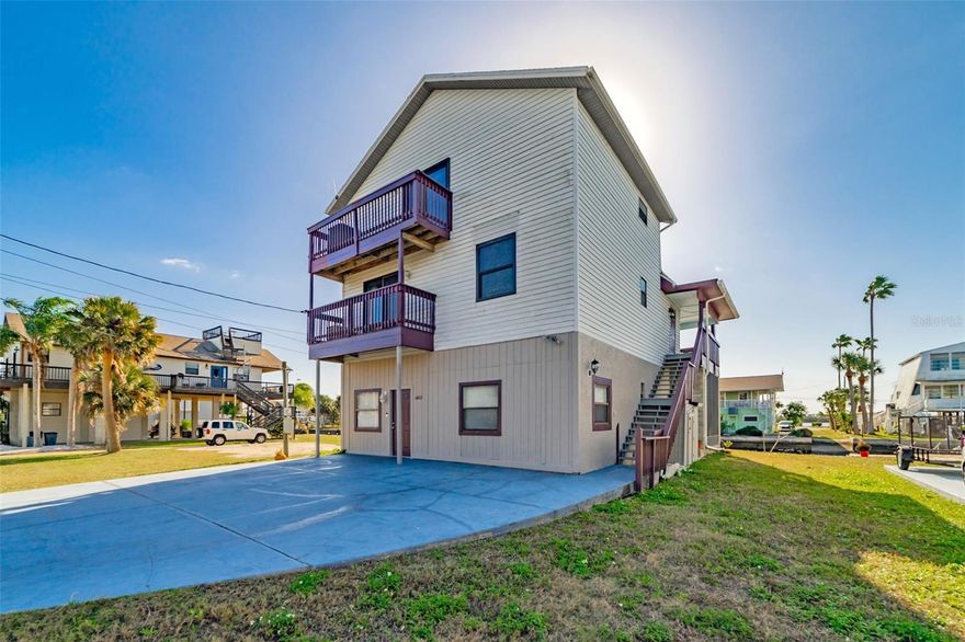 Wake up to breathtaking waterfront views overlooking the Gulf of America and a protected Bird Sanctuary. From magnificent sunsets to daily wildlife sightings, this home lets you enjoy nature without ever leaving your home. Watch dolphins and manatees play, cast a fishing line from your backyard, or take advantage of direct Gulf access— with just a short boat ride to Anclote Island and Hudson Beach and great fishing and boating. This unique three-story residence offers 3 bedrooms, 3 full bathrooms, and flexible living space on the first floor designed for coastal living. Large Master Retreat on the third floor has views of the Gulf, spacious bath area and walk in closet. Recent upgrades include newer hurricane-impact doors and windows. The kitchen features granite countertops and newer appliances, while an additional room off the kitchen complete with a washer and dryer closet would make an ideal home office or flex space. Additional features include a screened patio, a dedicated storage room, and multiple levels of living space that maximize the stunning views. With a little updating, this home has incredible potential to become the perfect waterfront retreat. Located in the quiet community of Driftwood Isles, this property offers peaceful coastal living while remaining conveniently close and within an hour’s drive of Clearwater and Tampa.