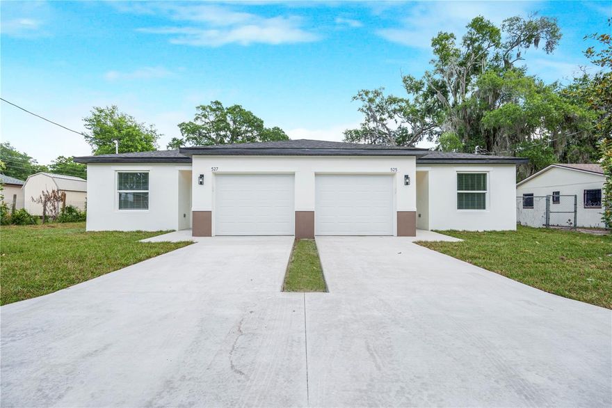 Discover exceptional modern living in this brand-new duplex located at 525 Pine Lane in Eustis, Florida. Each spacious unit features 3 bedrooms and 2 full bathrooms, offering a comfortable and functional layout perfect for homeowners or investors seeking strong rental potential.

Step inside to an inviting open-concept living room, a bright modern kitchen, and thoughtfully designed interiors with quality finishes throughout. Each unit includes its own private garage, providing convenience and additional storage space.

This newly built property offers peace of mind, and low-maintenance living. Whether you’re looking to live in one unit and rent the other, or add a high-performing asset to your portfolio, this duplex delivers outstanding value in a growing area.

Located just 5 minutes from downtown Eustis, shopping, dining, parks, and major roadways, this property combines comfort, style, and convenience in one exceptional package.

Don’t miss this opportunity to own a brand-new duplex in the heart of Eustis.