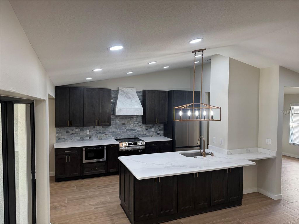 Photo of 2221 Cimarron Terrace, Palm Harbor, FL 34683 (MLS # TB8476424)