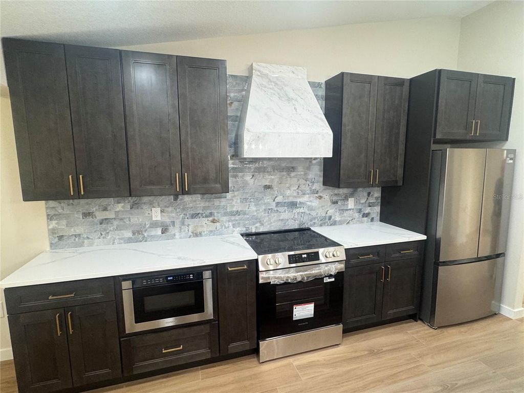 Photo of 2221 Cimarron Terrace, Palm Harbor, FL 34683 (MLS # TB8476424)