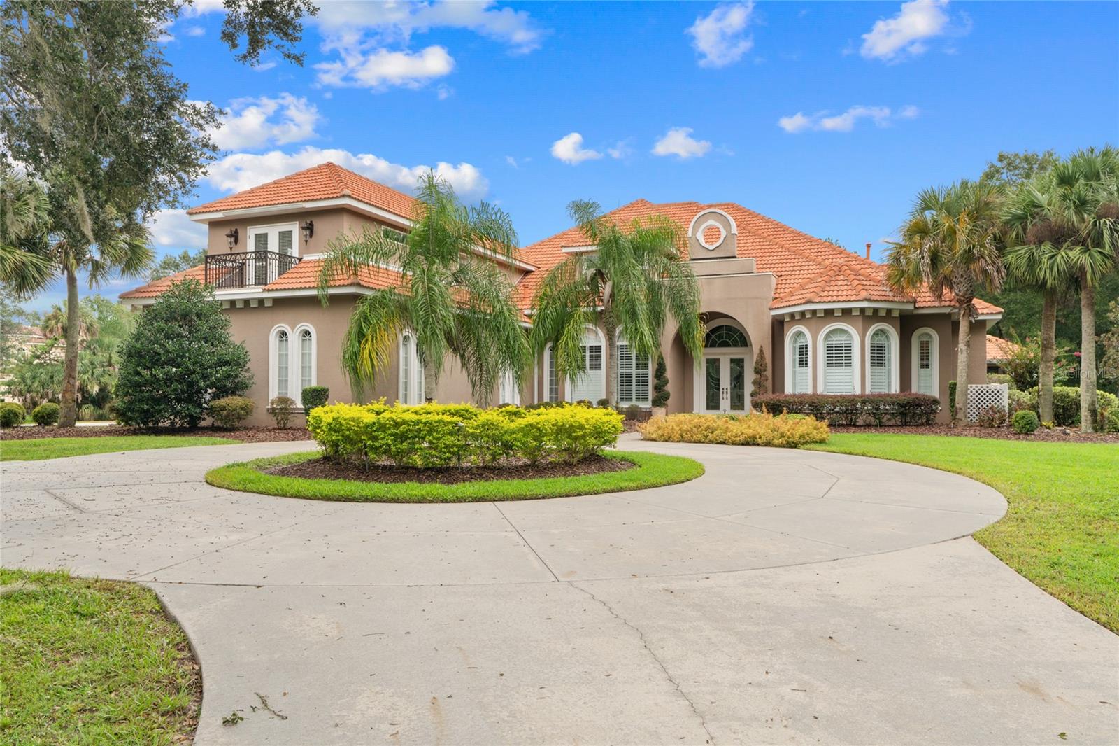 One or more photo(s) has been virtually staged. Discover this exceptional 5 bedroom, 4.5 bath, 4-car garage custom pool home located in the gated equestrian community of Country Club Farms. Nestled on just under 5 acres at the end of a cul-de-sac, the property is shaded by majestic granddaddy oaks and offers ample space to build a barn with all the equestrian amenities you desire.
The interior boasts an open-concept floor plan with 14 ft ceilings in the bedrooms and 16 ft in the living area, ideal for family gatherings and entertaining, with a spacious eat-in kitchen, formal dining area, and a striking fireplace as the centerpiece. Designed for versatility, the split floor plan provides multiple living arrangements, perfect for multi-generational living. Three separate living areas, one with its own kitchen, feature private entrances, ensuring comfort and privacy. Additional highlights include, Whole-house generator for peace of mind, three fireplaces adding charm and warmth ,theatre room for private movie nights, multiple flex rooms ideal for offices, playrooms, or sitting areas, two Rinnai tankless water heaters with temperature control in two bathrooms, expansive screened lanai with resort-style pool, waterfalls, and lush landscaping. The under-air basement with secure entry and roll-up rear access offers excellent storage or workshop space.
This property seamlessly blends elegance, functionality, and the freedom to create your dream lifestyle whether it's an equestrian property or acreage to enjoy .